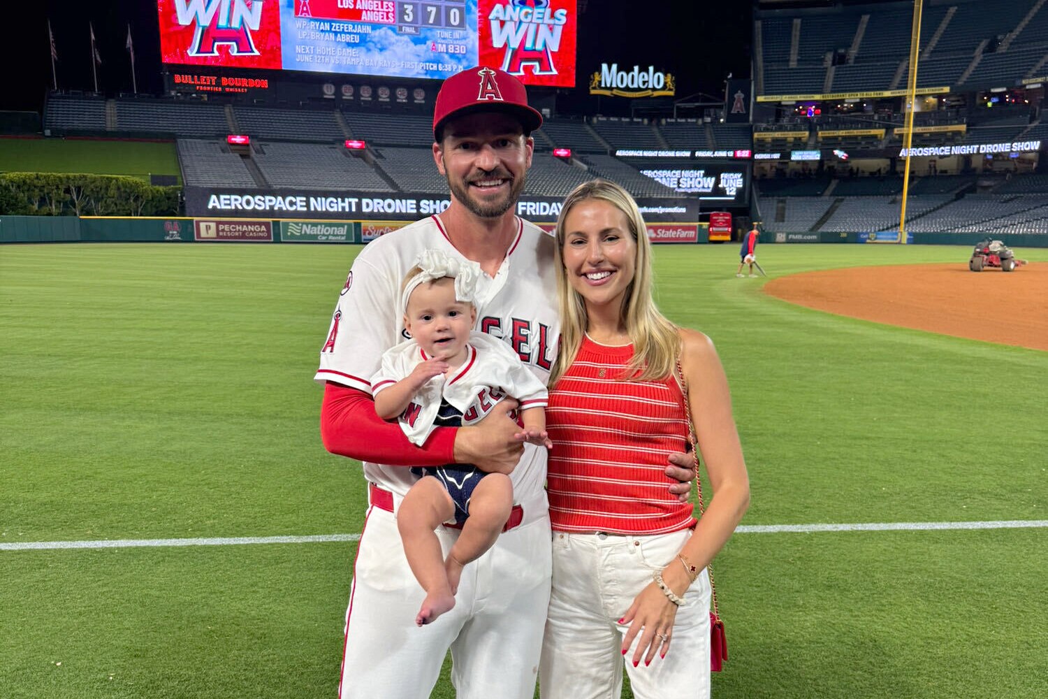 Trey Mancini and his wife, Sadie, pose with their daughter Sadie at Angel Stadium on June 8, when Mancini made his return to Major League Baseball.