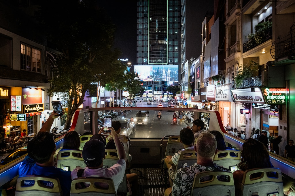 Ho Chi Minh, Vietnam - Aug 5, 2026: Danny Hoang, 56, and Melissa Tran, 44, take their children and nephew to a sightseeing bus tour around Ho Chi Minh City, Vietnam on August 5, 2026. This is their first reunion since Melissa was deported to Vietnam last November. Rosem Morton for The Baltimore Banner