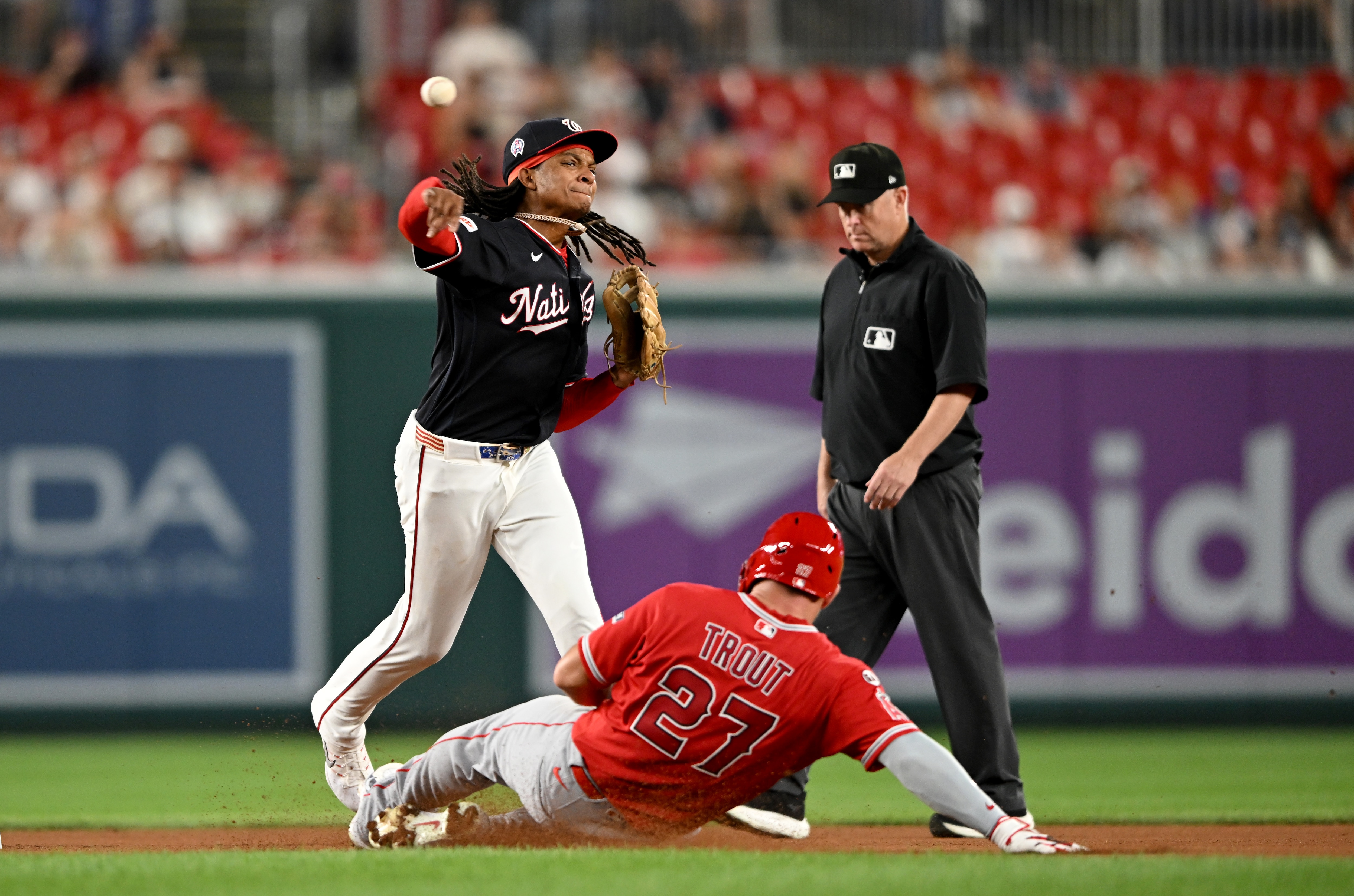 CJ Abrams forces out Mike Trout of the Angels to start a double play in the fourth inning Friday night at Nationals Park.