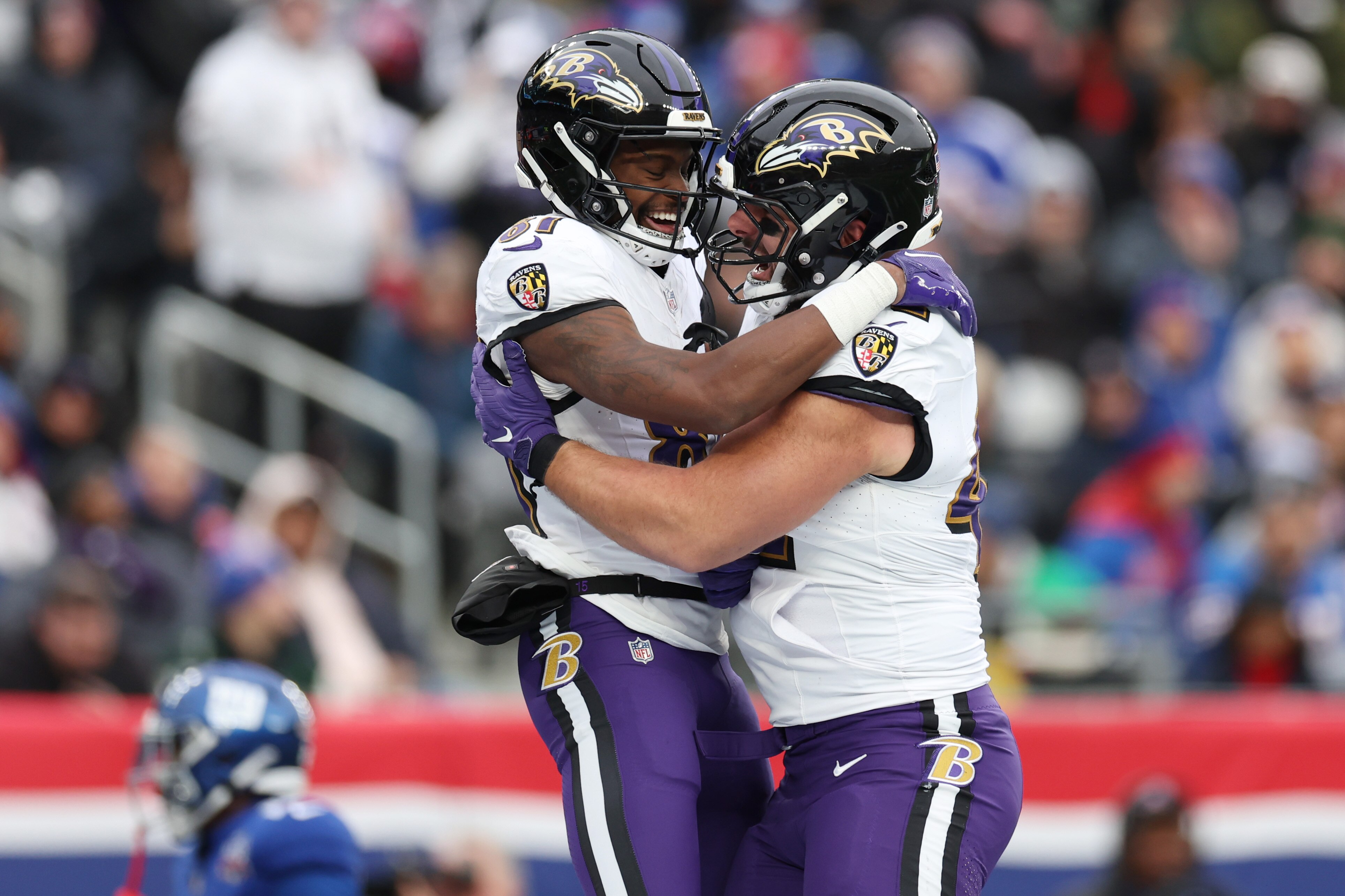Devontez Walker (left) hugs Patrick Ricard after Walker’s first NFL reception resulted in a touchdown Sunday against the Giants.