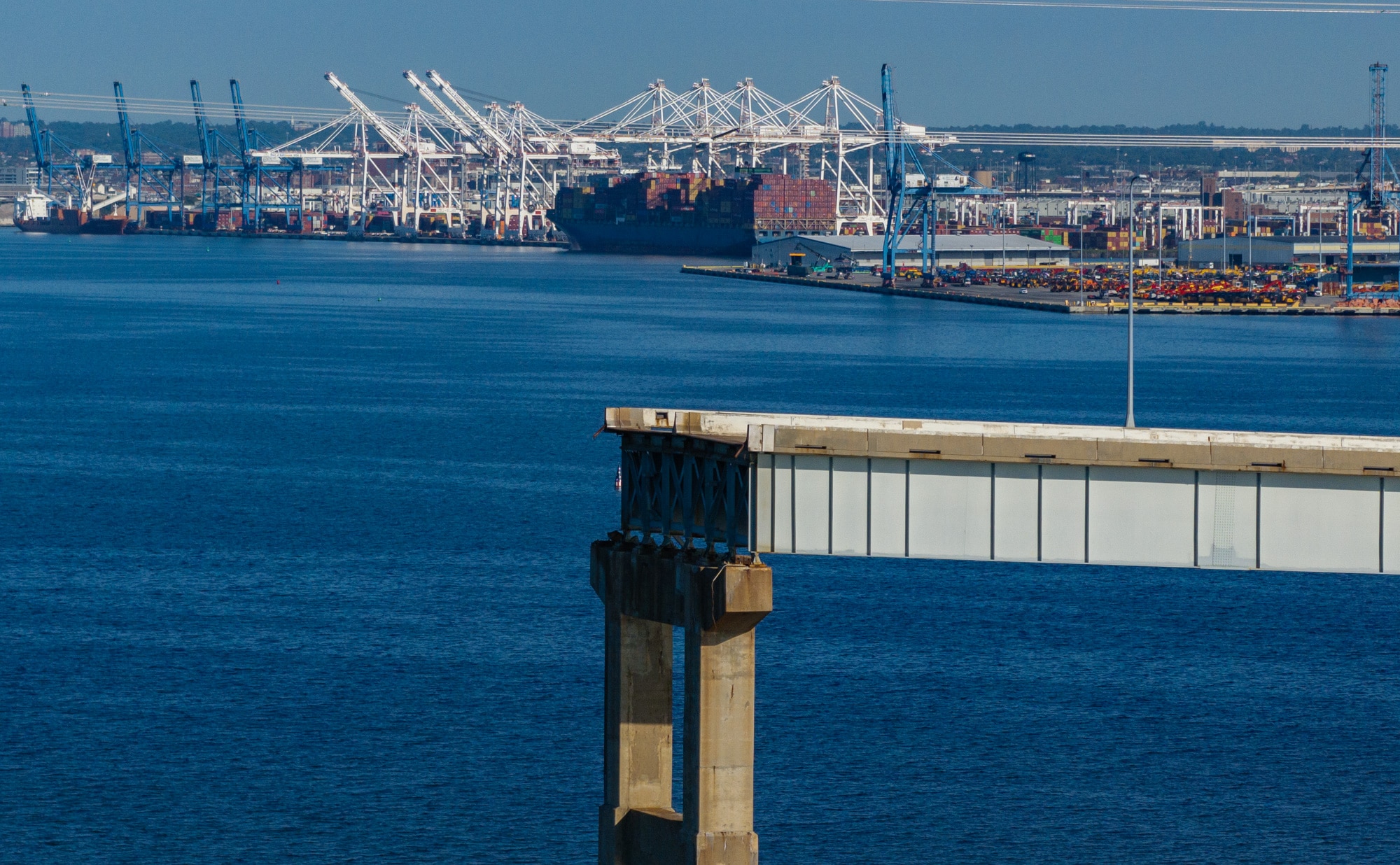 The east ramp of the Francis Scott Key Bridge juts over the Patapsco River almost six months after the container ship Dali lost power and hit a support pier, causing a catastrophic collapse.