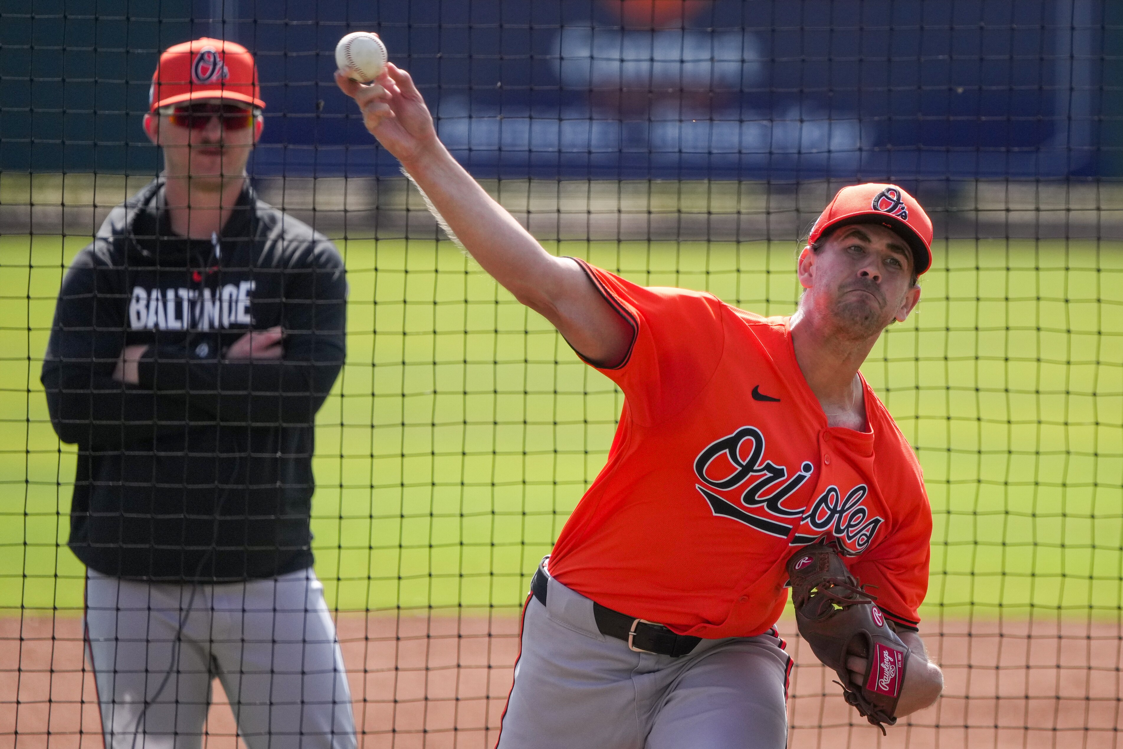 Baltimore Orioles starting pitcher Dean Kremer (64) pitches during the team’s spring training session at Ed Smith Stadium on Feb. 23, 2024.