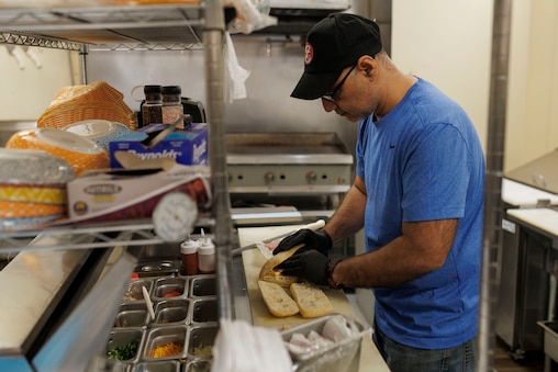 Wednesday, Feb. 4, 2026, in Clarksburg, MD— Ashar Abbasi, owner of K2 Cafe, makes paninis.
