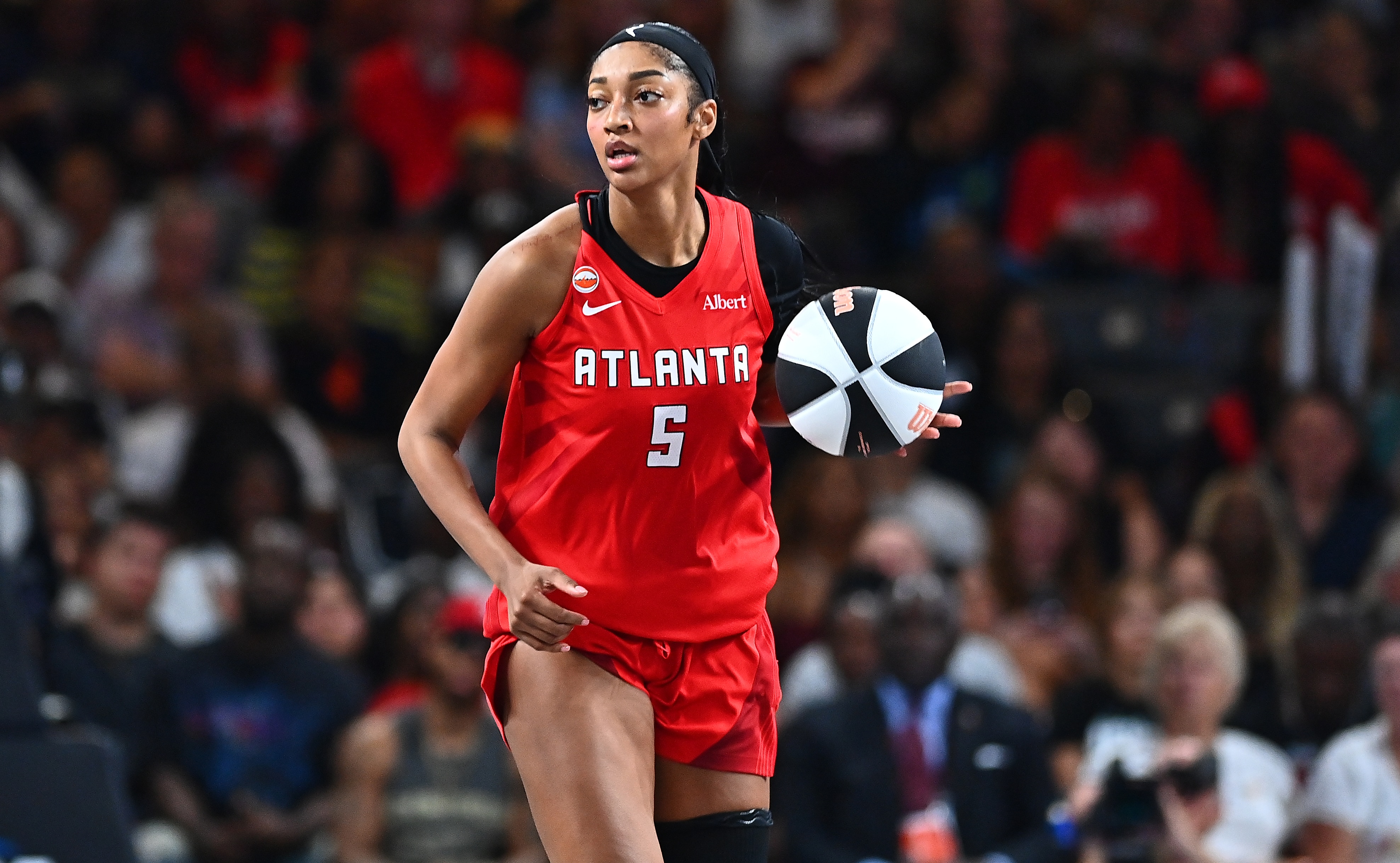 COLLEGE PARK, GEORGIA - JUNE 11: Angel Reese #5 of the Atlanta Dream brings the ball up the court against the New York Liberty during the fourth quarter at Gateway Center Arena on June 11, 2026 in College Park, Georgia.  NOTE TO USER: User expressly acknowledges and agrees that, by downloading and or using this photograph, User is consenting to the terms and conditions of the Getty Images License Agreement.  (Photo by Paras Griffin/Getty Images)