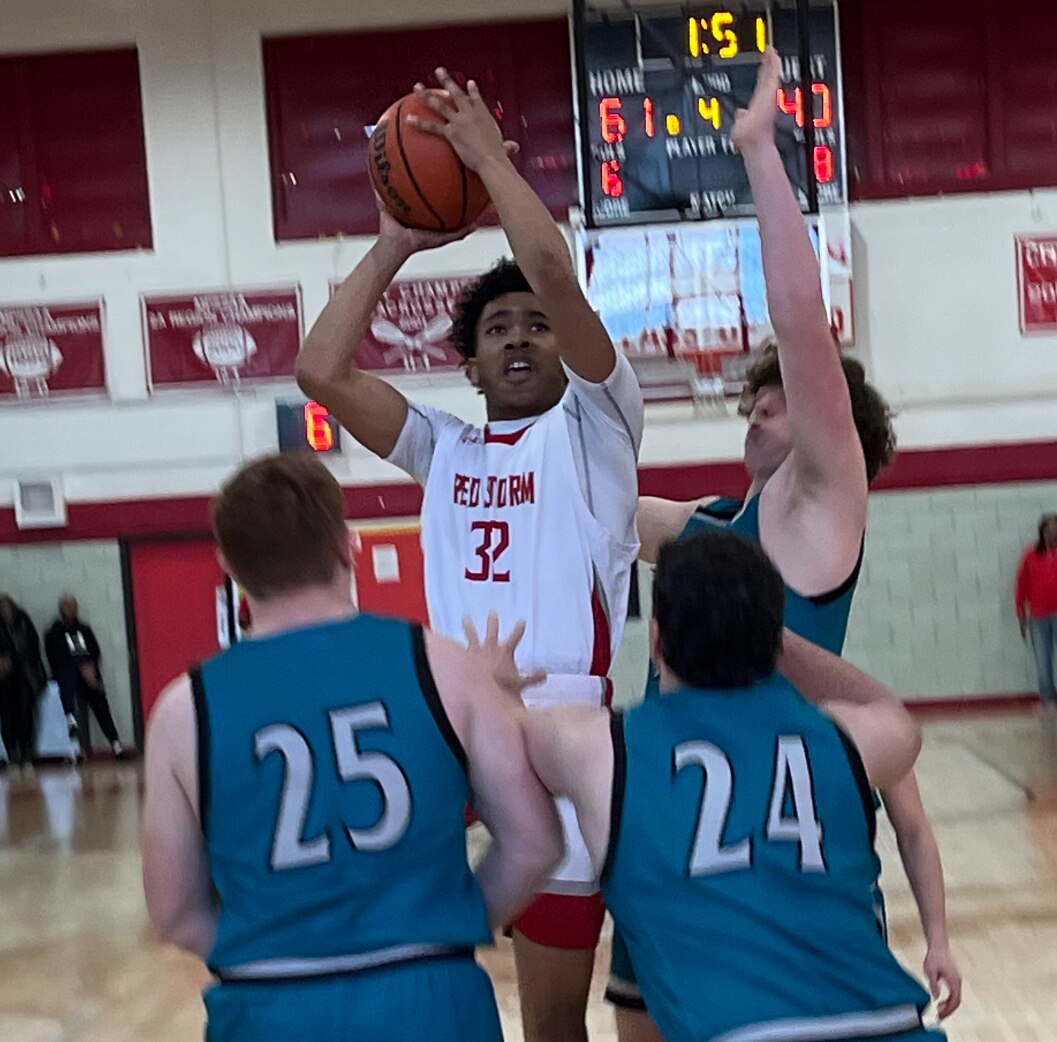 Edmondson's Khamari Stubbs (32) attempts a shot during Saturday's Class 1A state boys basketball quarterfinal match with Patterson Mill. The No. 8 Red Storm advanced to the state semifinals with a 65-45 victory over the Huskies in West Baltimore. (Derek Toney)