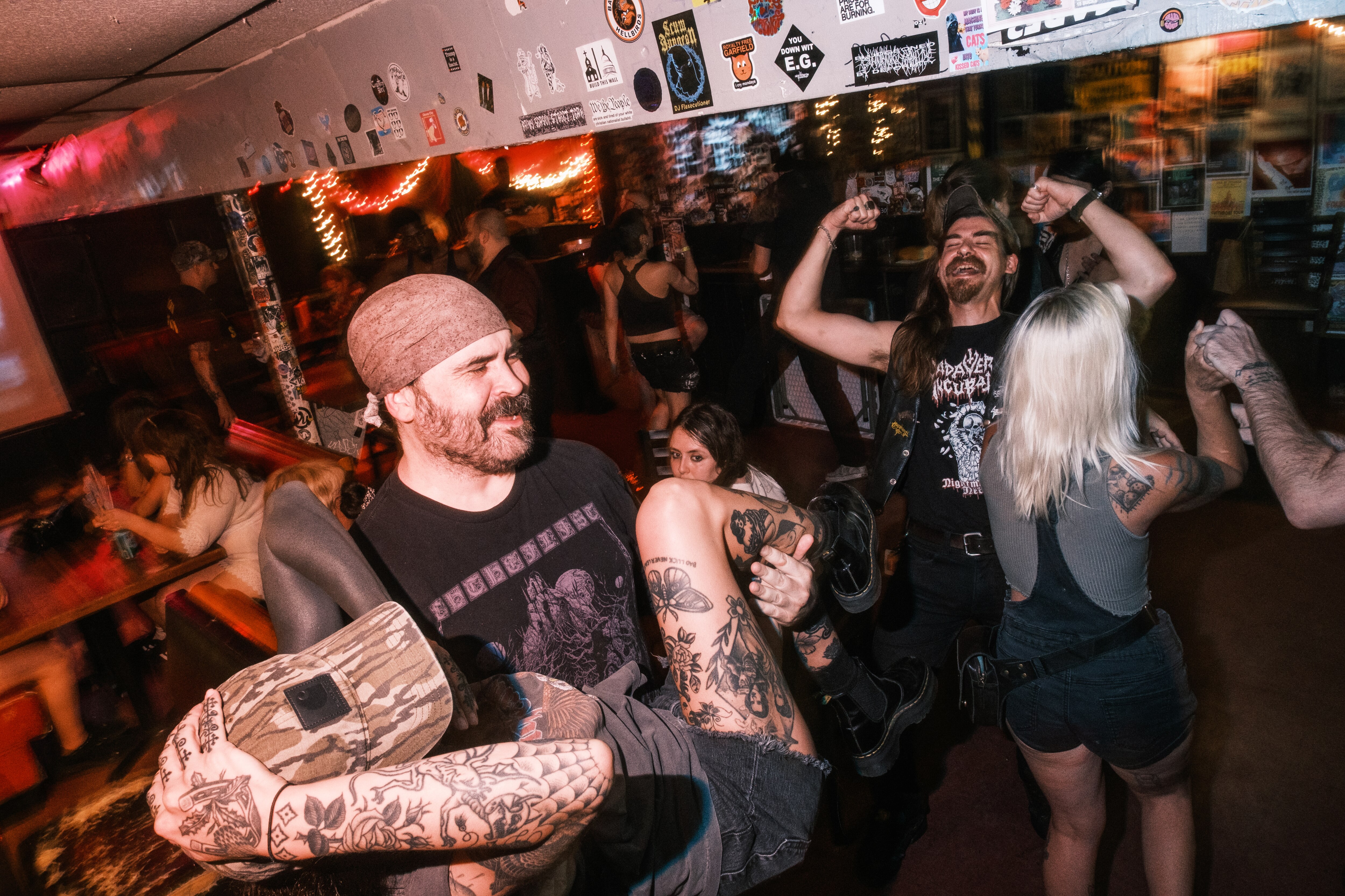 Jeremy, left, lifts his friend as others cheer during this week’s Ozzy Osbourne-themed Metal Monday at the Ottobar.