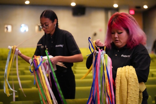 MICA students Anaitza Brown, left, and Pasi Lee collect discarded ribbons following MICA’s bicentennial anniversary celebration at Falvey Hall on MICA’s campus in Baltimore, Md., on Wednesday, January 21, 2026.