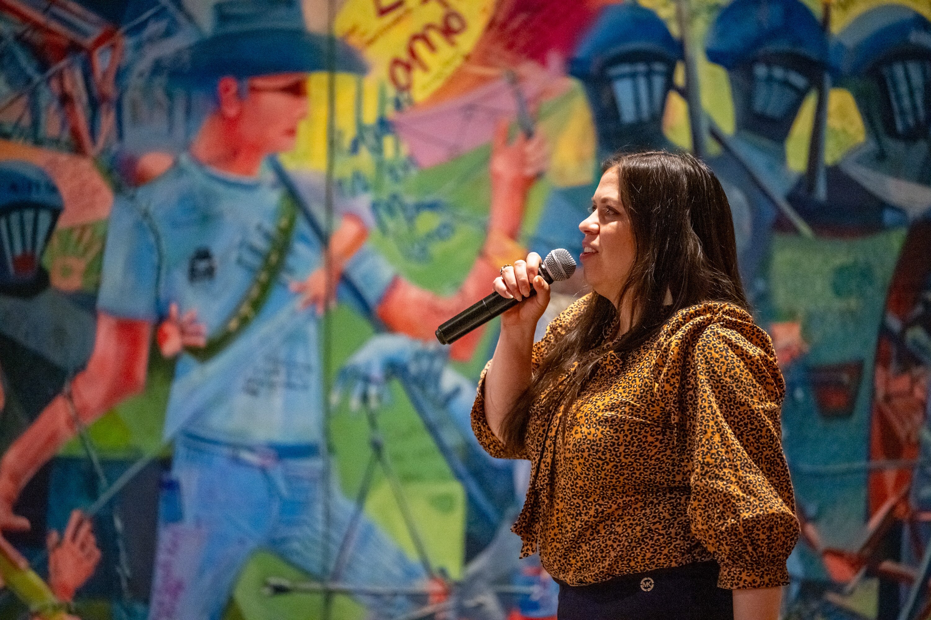 Oral historian Maria Gabriela Aldana speaks at the Echoes from the Key Bridge event held at the Baltimore Museum of Industry.