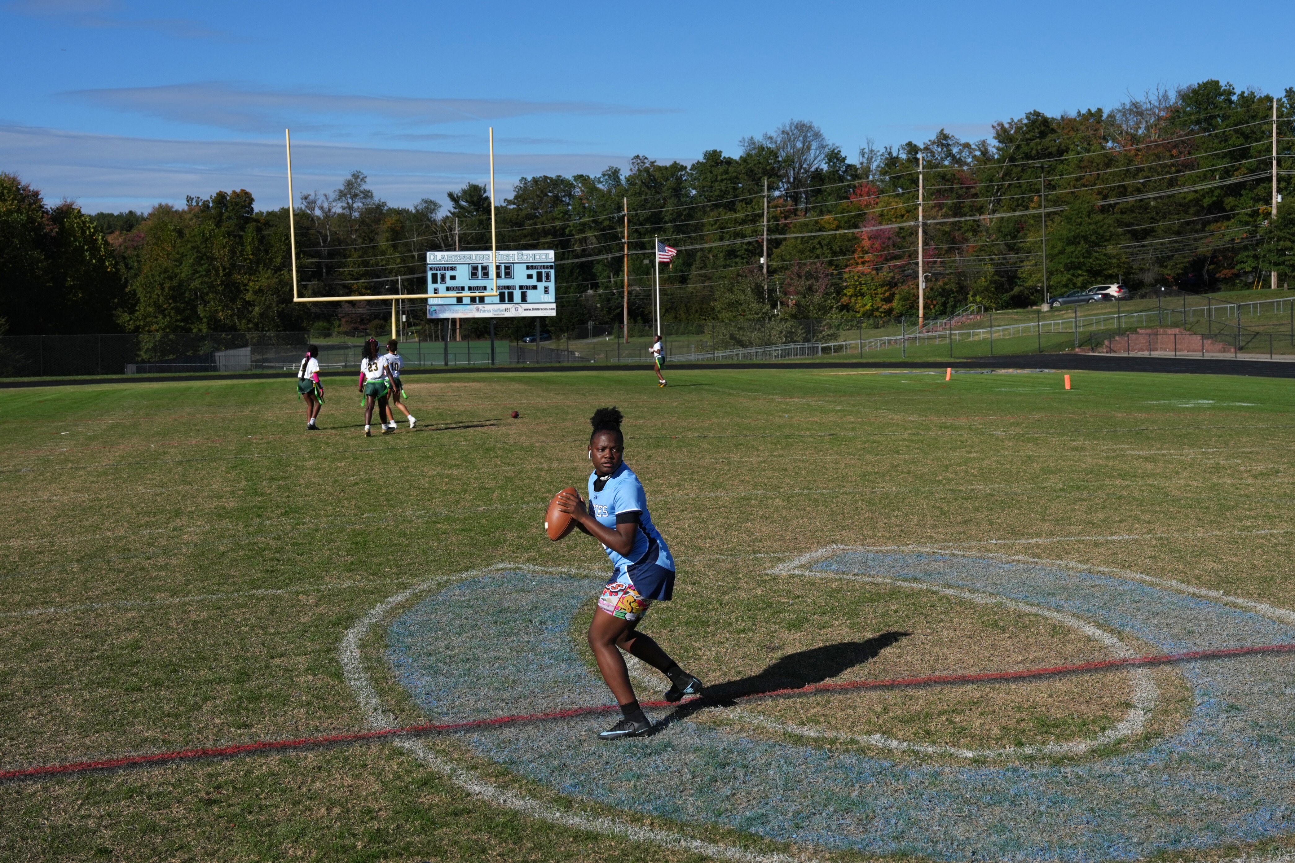 Aysia Jones-Robinson, the quarterback for Clarksburg High School’s girls flag football team, warms up before a game.