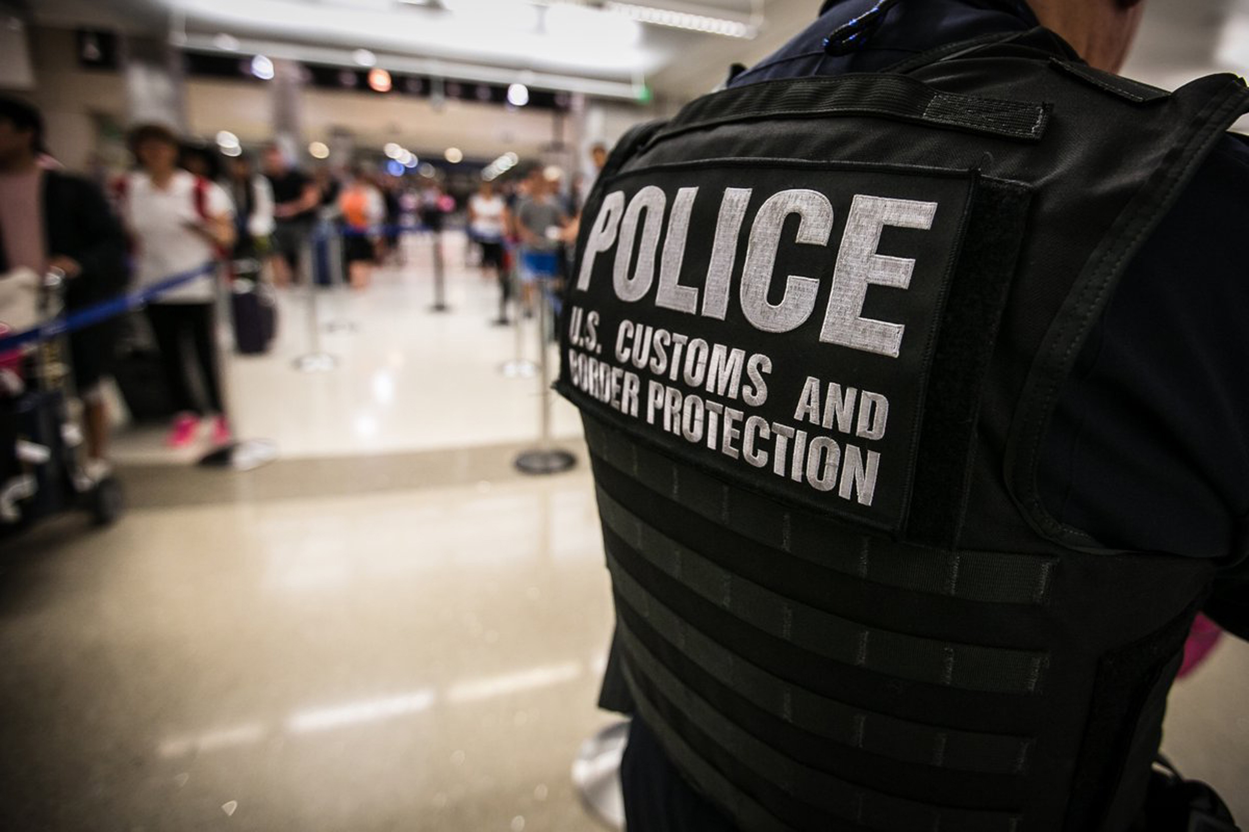 A Customs and Border Patrol agent in an airport.