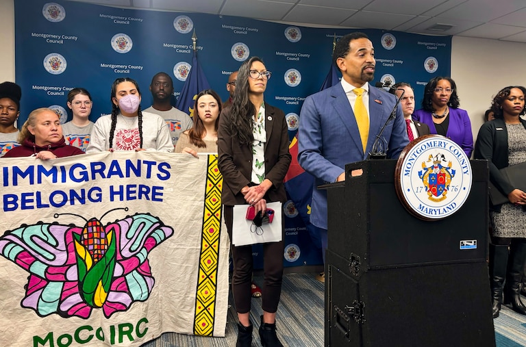 TUESDAY, JANUARY 20, 2026 - Montgomery County Council members Will Jawando and Kristin Mink are flanked by supporters as they hold a press conference on two bills that aim to restrict ICE activities in the county.