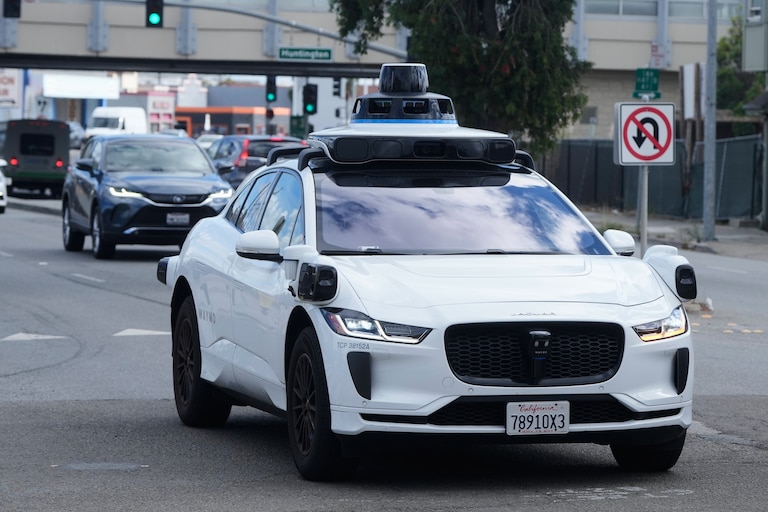 A Waymo vehicle drives past a No U-Turn sign in San Bruno, Calif., Tuesday, Sept. 30, 2025.