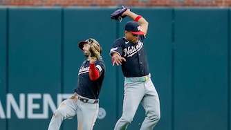 Washington Nationals second baseman José Tena, right, catches fly ball hit by Atlanta Braves catcher Joey Bart, as Nationals right fielder Dylan Crews avoids a collision during the second inning of a baseball game, Friday, July 31, 2026, in Atlanta. (AP Photo/Erik S. Lesser)