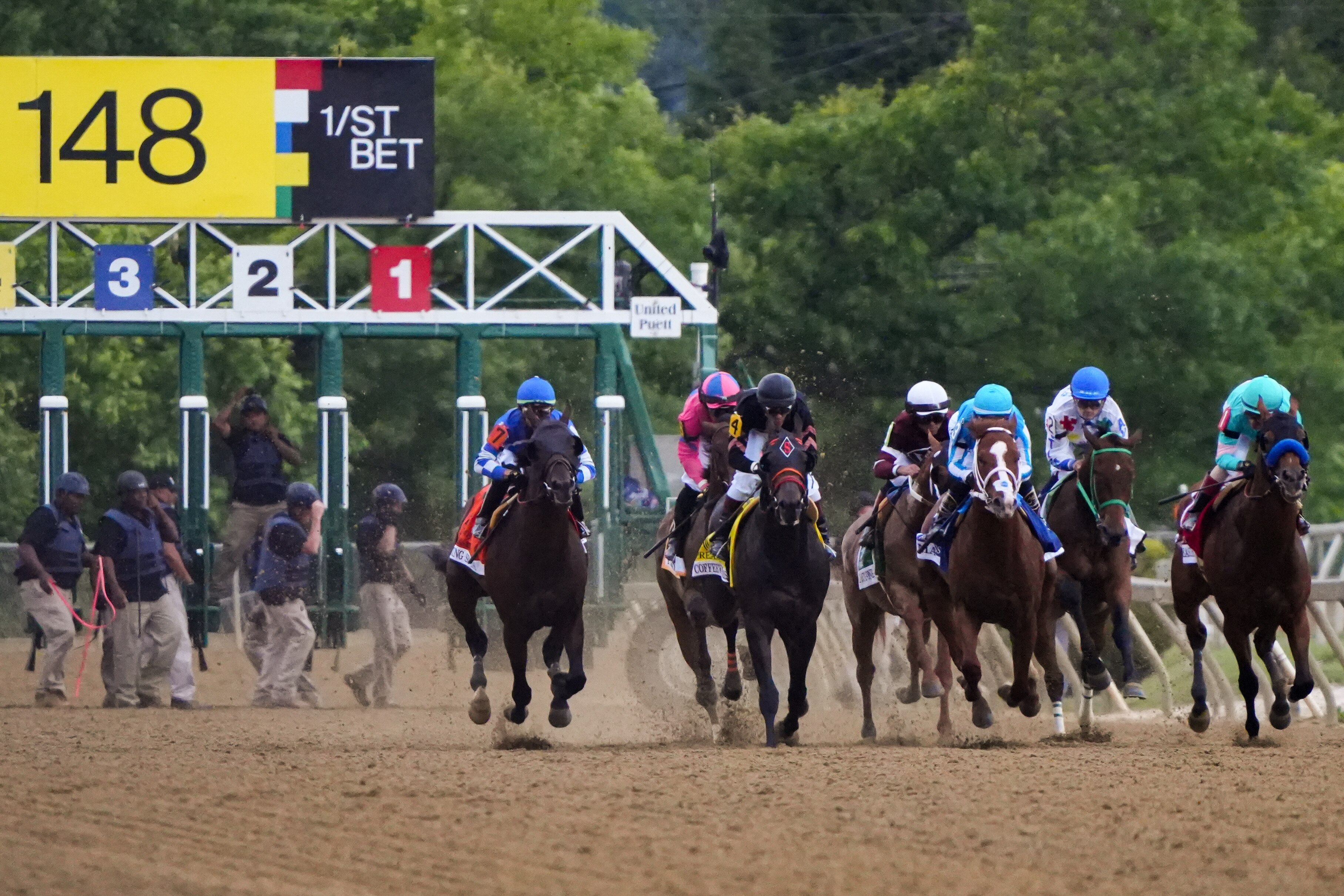 Horses take off from the starting gate at the beginning of the 148th running of the Preakness Stakes at Pimlico Race Course on May 20, 2023.