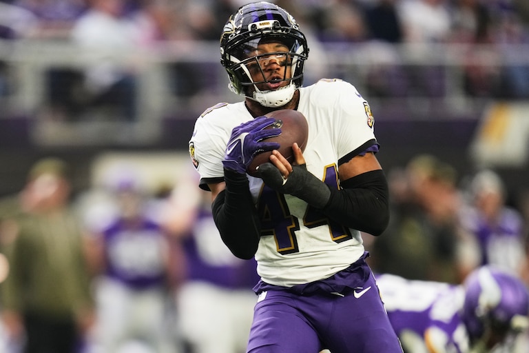 Baltimore Ravens cornerback Marlon Humphrey (44) intercepts a pass against the Minnesota Vikings in the second half of an NFL football game, Sunday, Nov. 9, 2025, in Minneapolis.