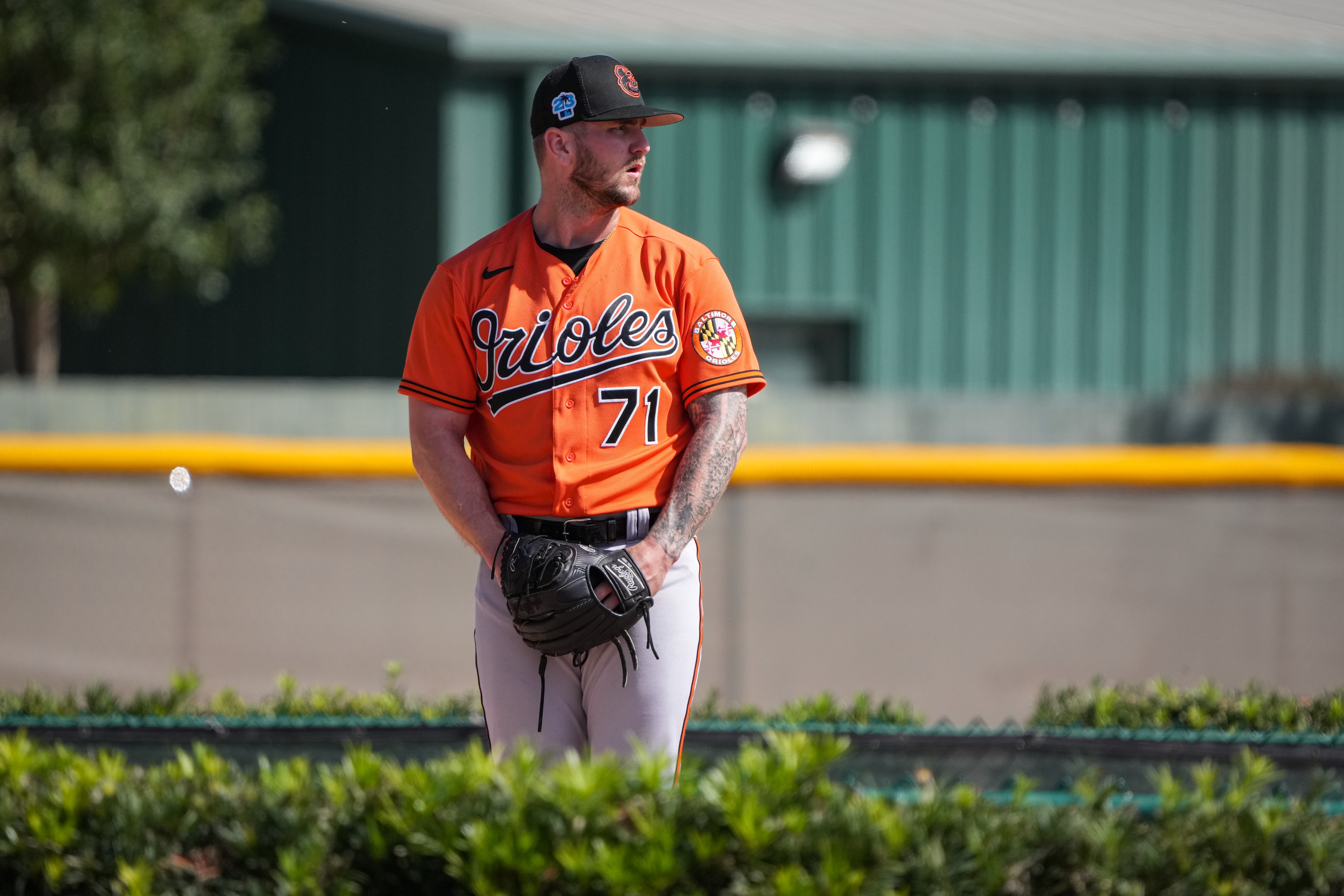 Logan Gillaspie (71) prepares to deliver a pitch during batting practice at Ed Smith Stadium in Sarasota on 2/22/23. The Baltimore Orioles’ Spring Training session runs from mid-February through the end of March.