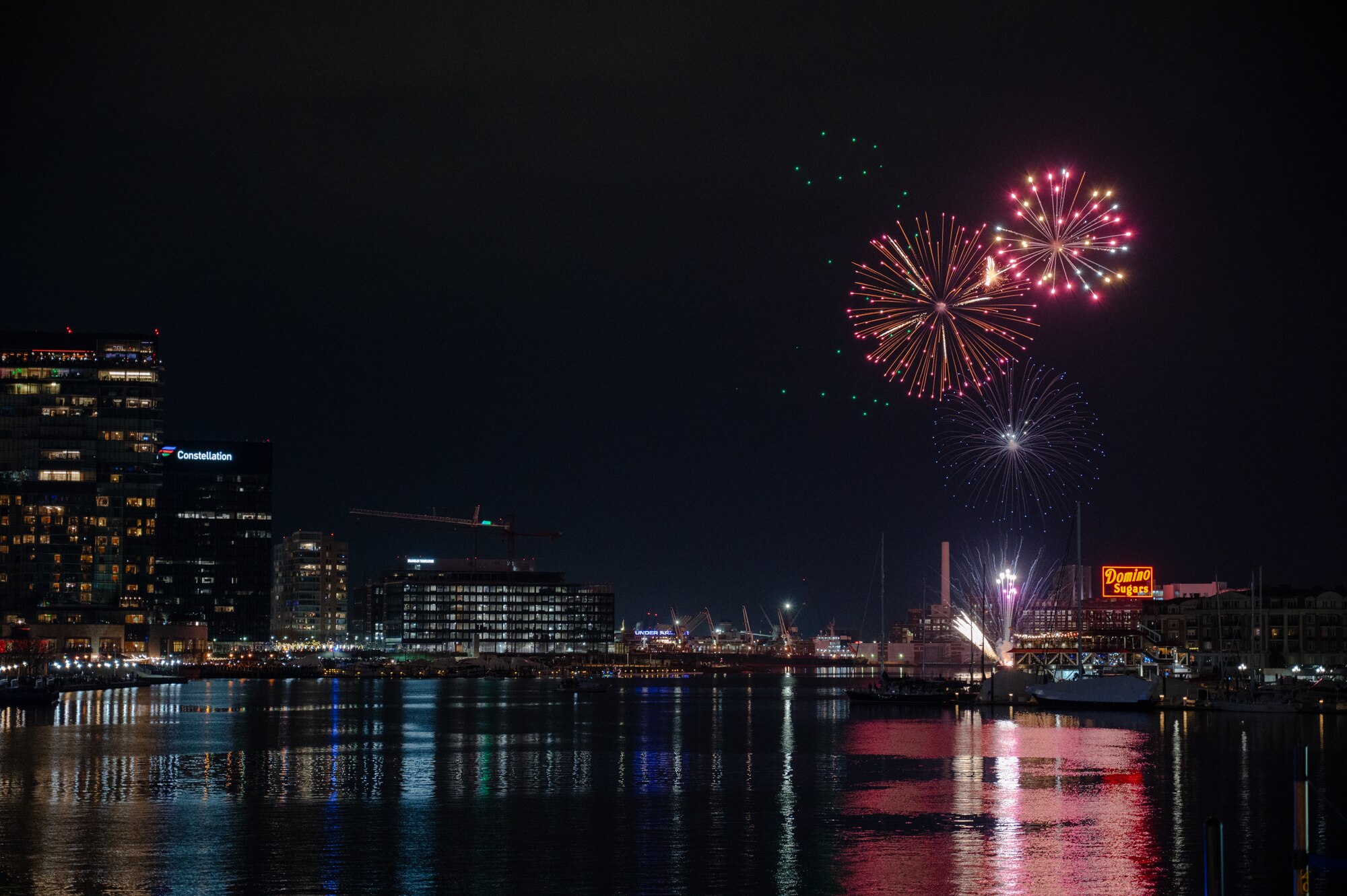 Fireworks are shot off in the Inner Habor to celebrate the new year on Jan. 1, 2024.