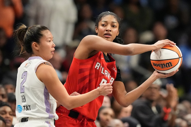 Atlanta Dream's Angel Reese, right, looks to pass past Golden State Valkyries' Kaitlyn Chen during the first half of Game 6 of the WNBA Finals on Thursday.
