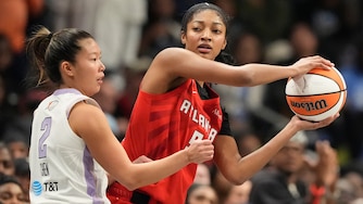 Atlanta Dream's Angel Reese, right, looks to pass past Golden State Valkyries' Kaitlyn Chen during the first half of Game 6 of the WNBA Finals on Thursday.