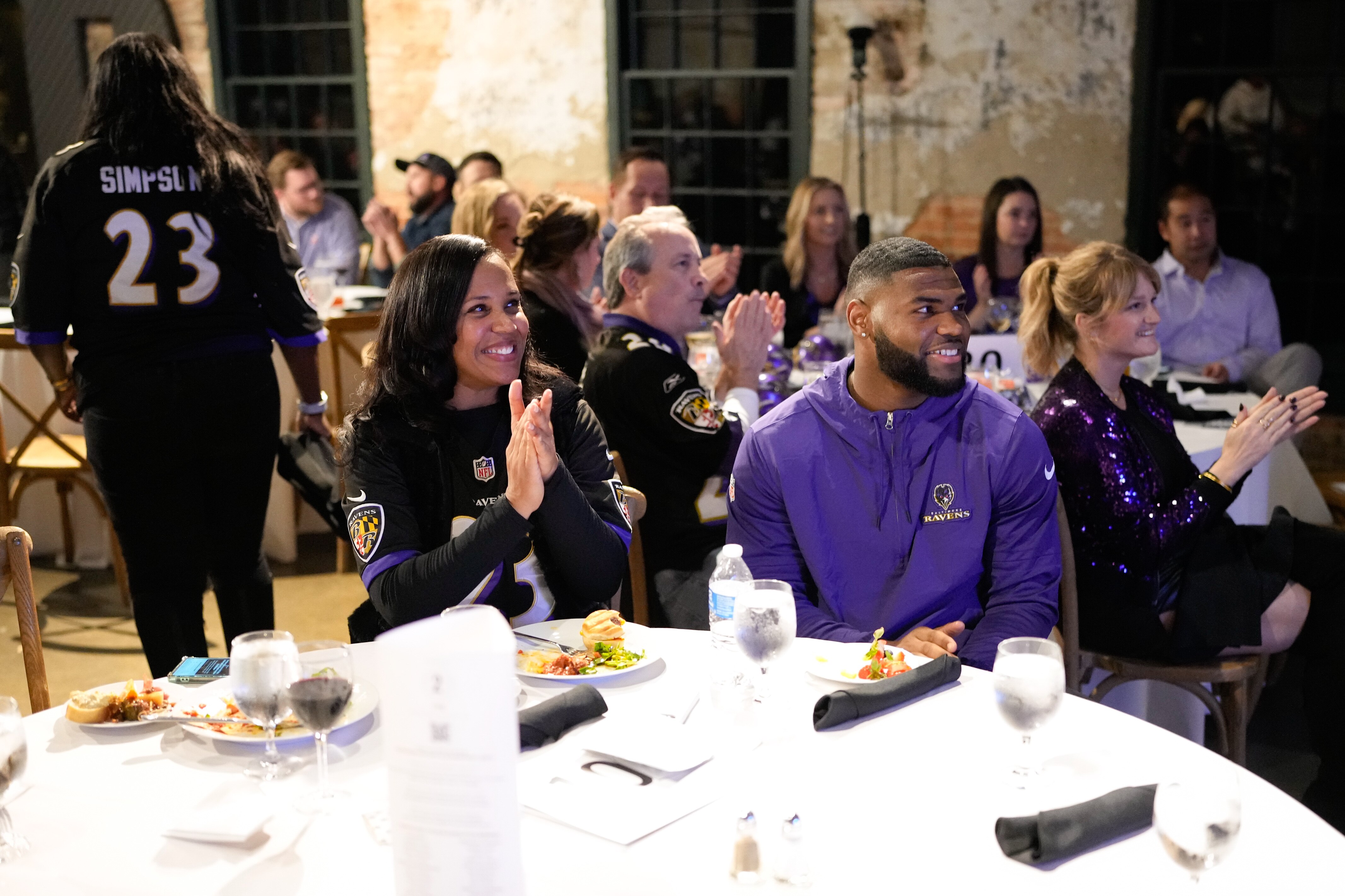Ravens linebacker Trenton Simpson, right, sits with his mother, Dionna Ford, during his Foundation’s inaugural Tribute to Troops Tailgate at the Mt. Washington Mill Dye House in Baltimore.