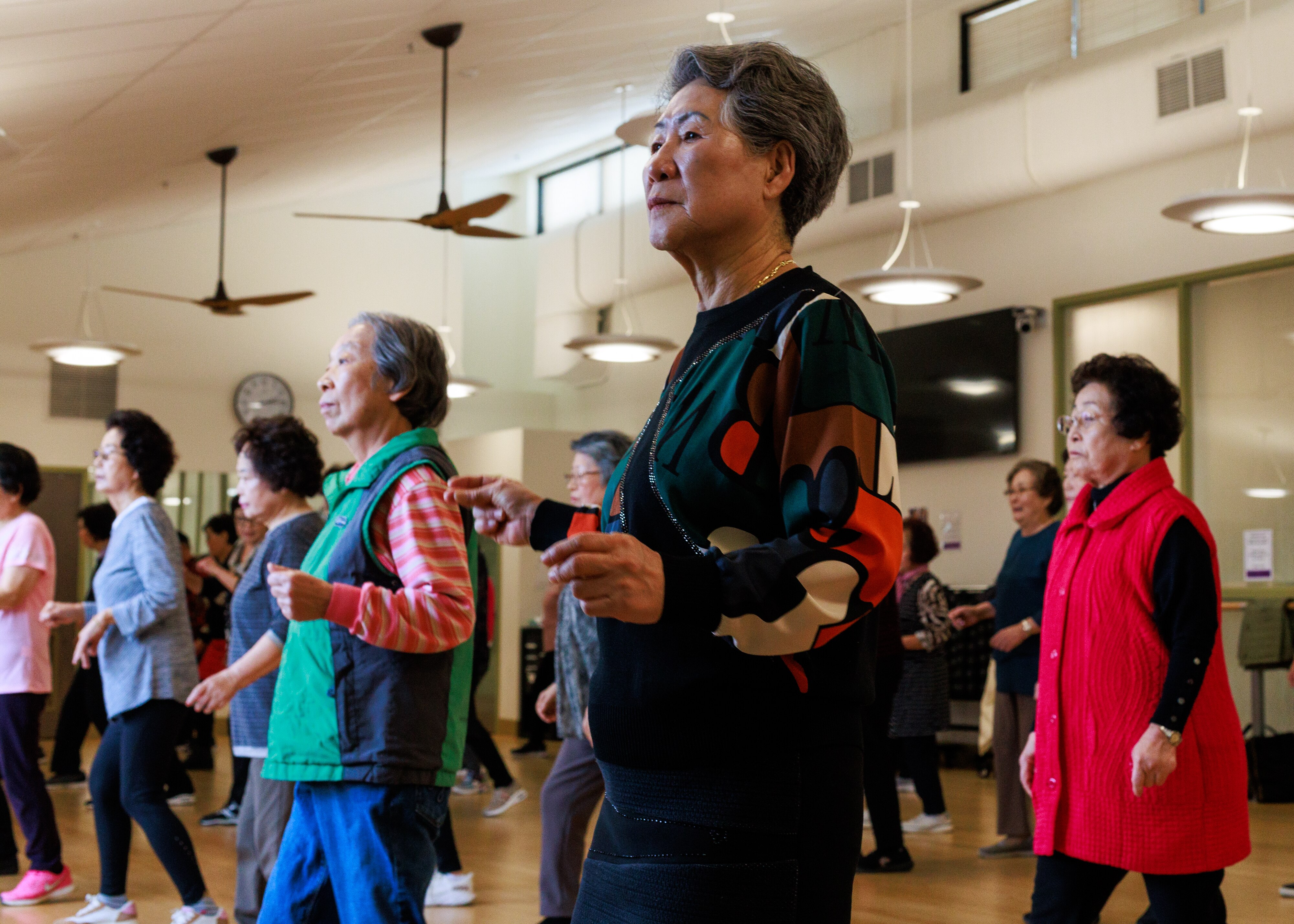 Members of the Korean American Senior Association of Howard County participate in a line dancing class at the Bain 50+ Center in Columbia, MD, on February 5, 2025.