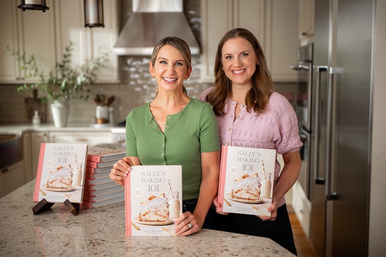 Sally McKenney, left, and Beth Walk pose with copies of their New York Times bestselling cookbook, "Sally's Baking 101."