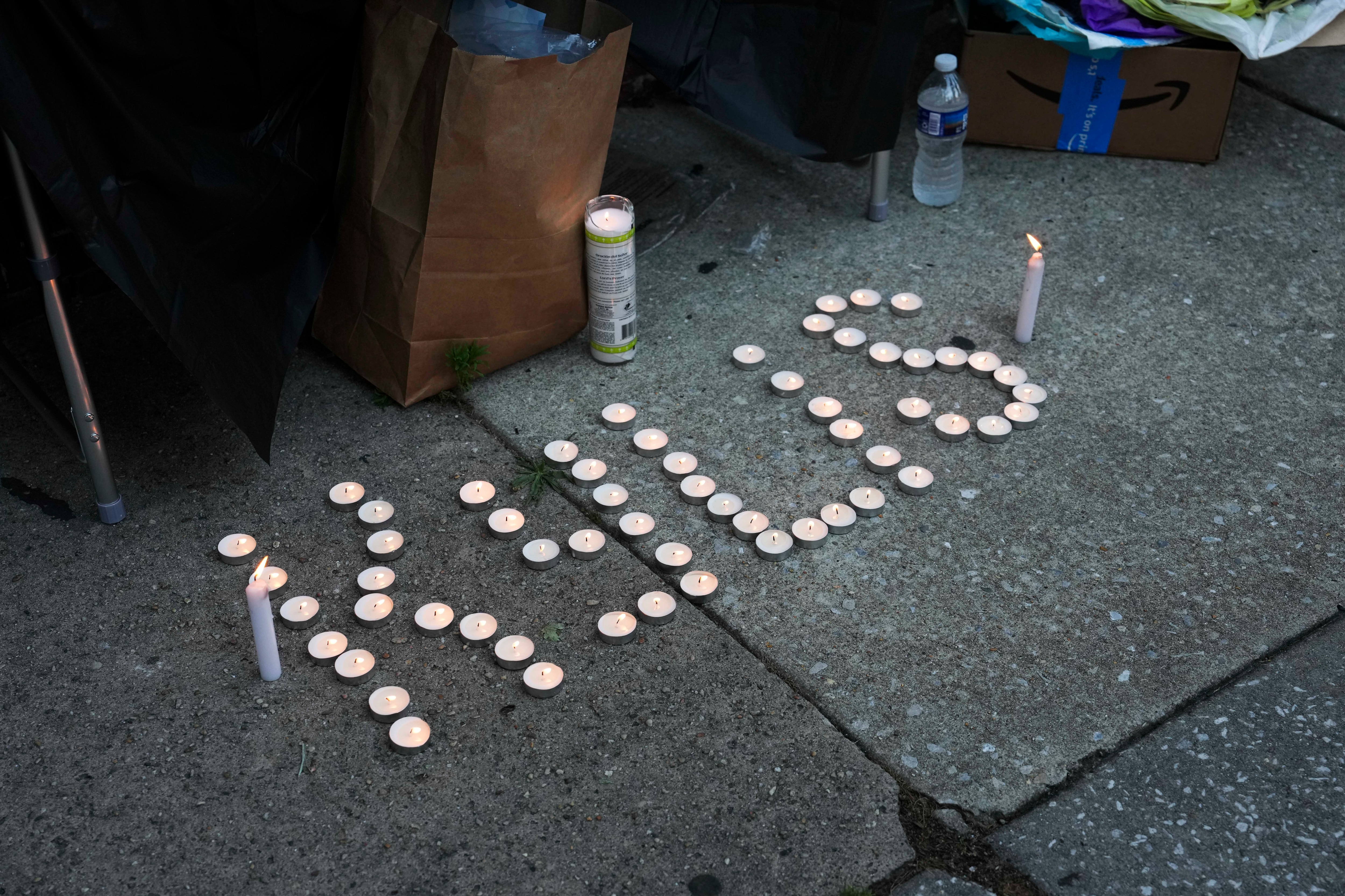 Loved ones hold a vigil in honor of Kylis Fagbemi, 20, on July 11. Fagbemi was shot and killed at a Brooklyn Homes block party on July 2.