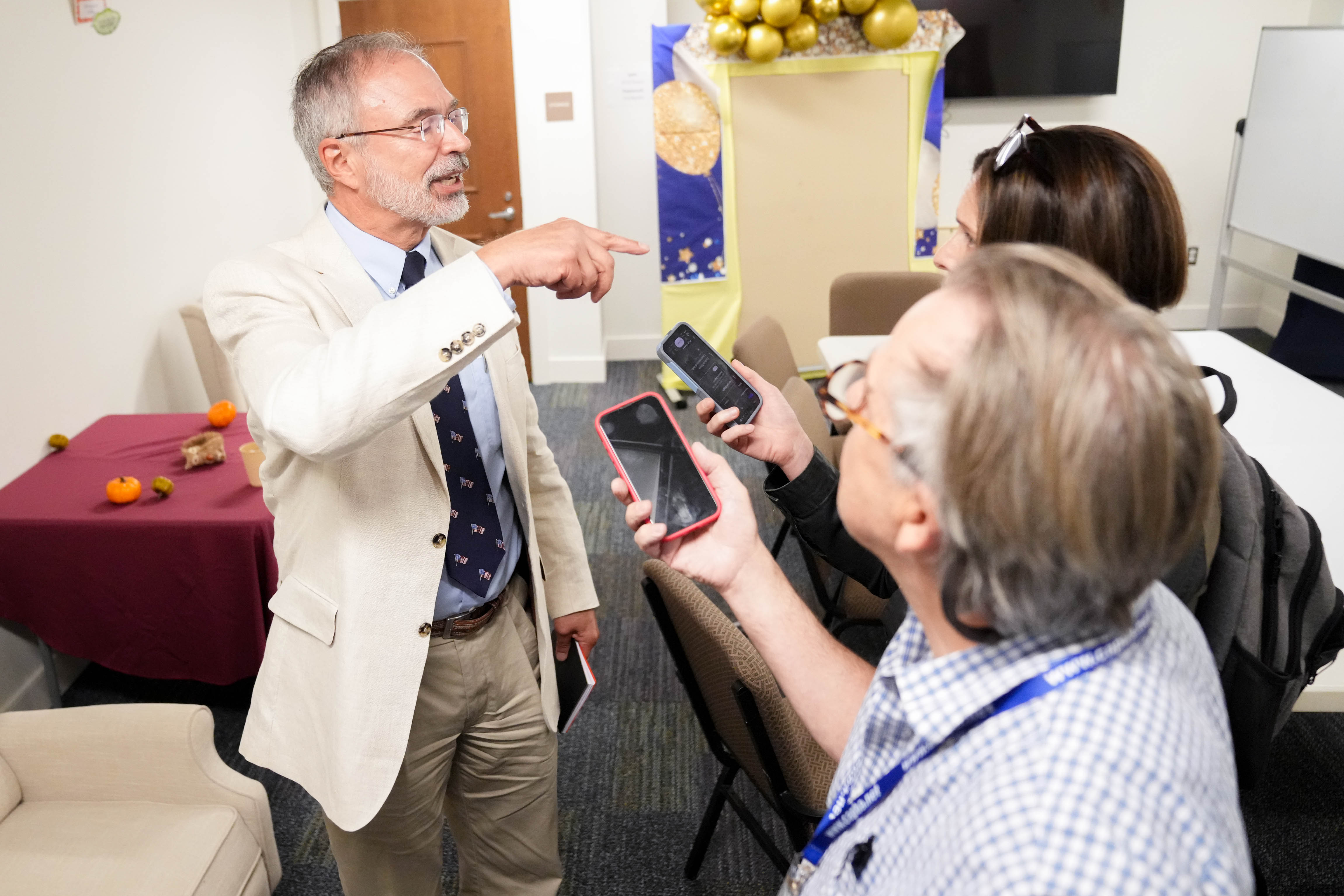 U.S. Rep. Andy Harris talks with reporters following a debate Tuesday. A confrontation with a student reporter has since gone viral.