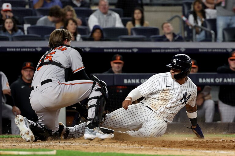 Gleyber Torres #25 of the New York Yankees is out at home as Adley Rutschman #35 of the Baltimore Orioles makes the tag in the seventh inning at Yankee Stadium on May 23, 2023 in Bronx borough of New York City.