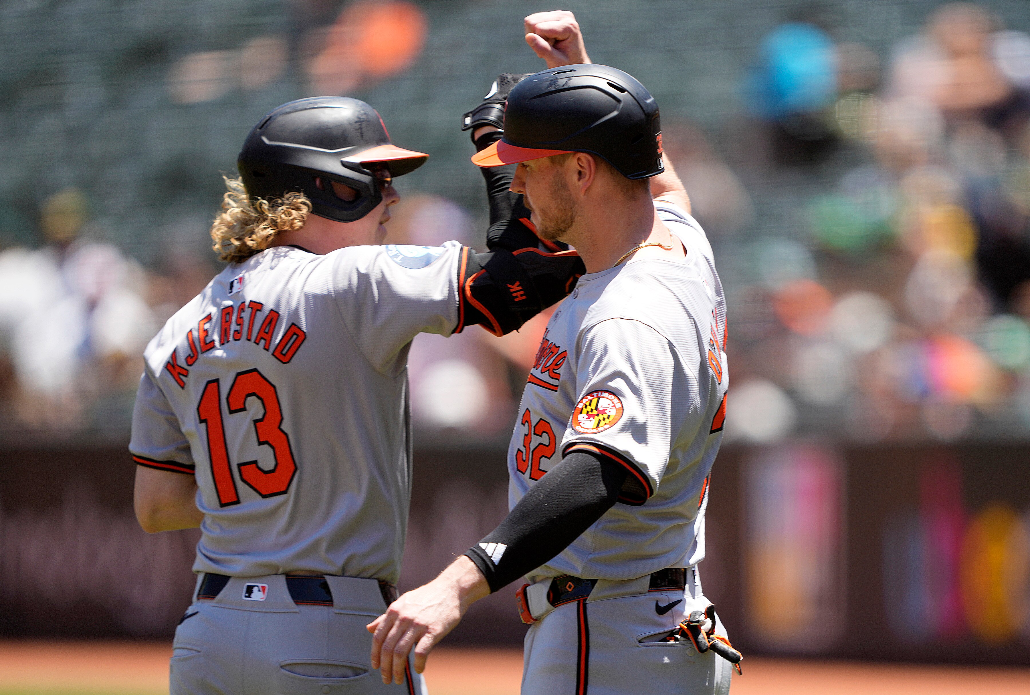 Heston Kjerstad receives congratulations from Ryan O’Hearn after his first-inning home run Sunday in Oakland.