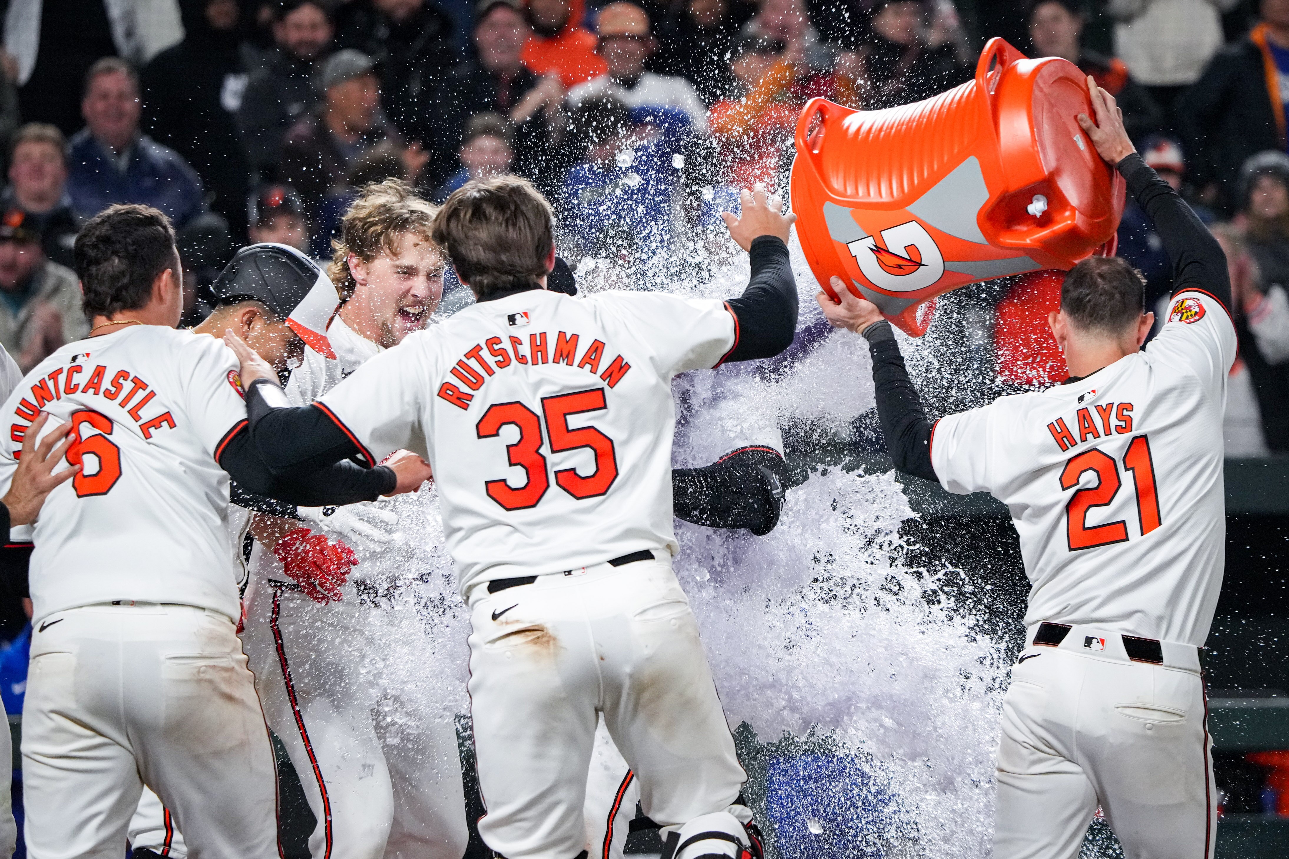 Baltimore Orioles second baseman Jordan Westburg is doused by his teammates after he hit a two-run homer in the ninth inning for a walk-off win over the Kansas City Royals at Camden Yards on April 1, 2024.