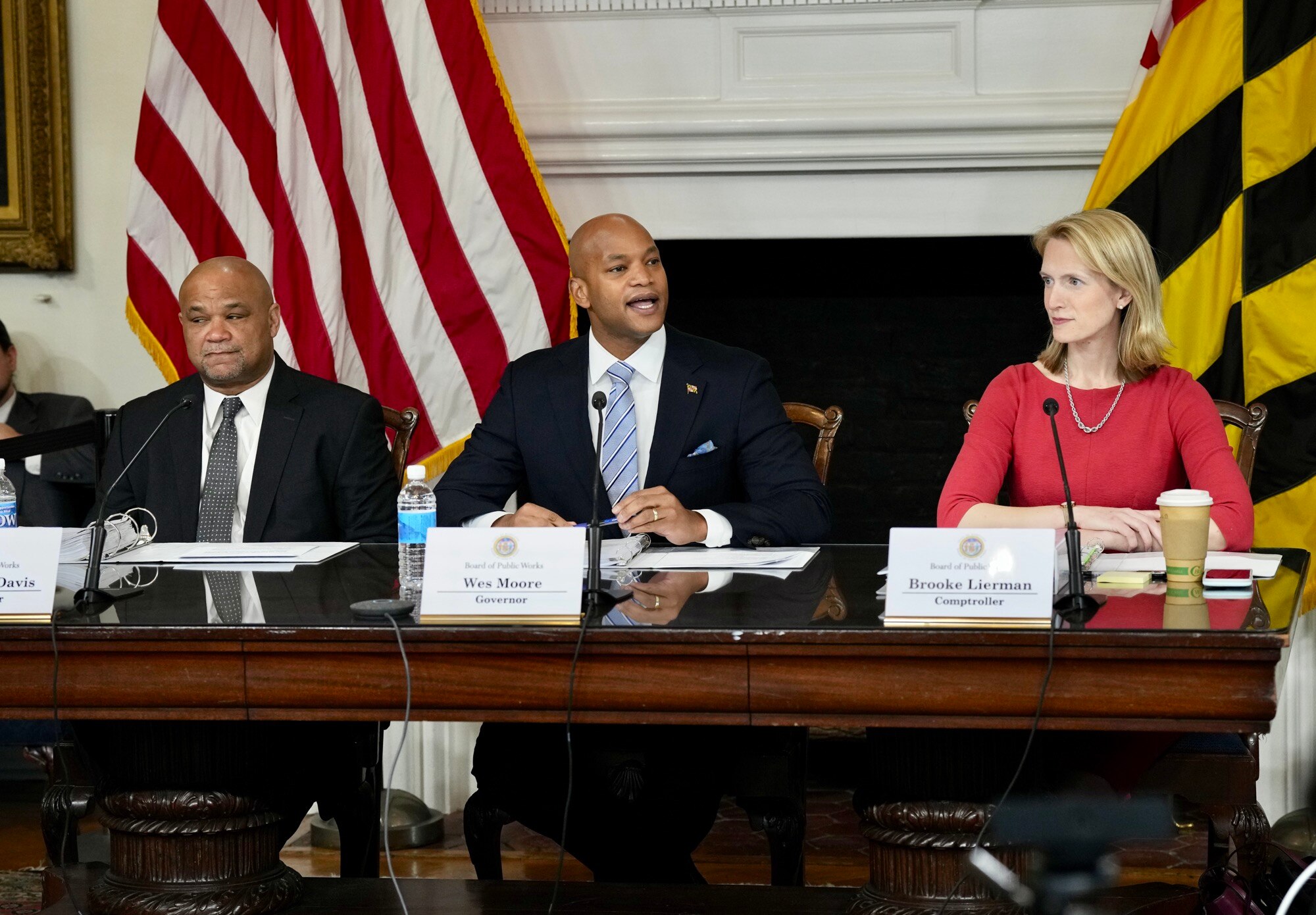 Governor Wes Moore, center, Treasurer Dereck Davis, left, and Comptroller Brooke Lierman, right, have the first annual meeting of the Maryland Board of Public Works at the Maryland State House on January 25, 2023.