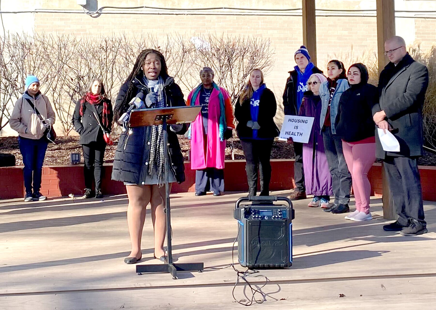 NaShona Kess, vice president of the NAACP Baltimore City chapter, speaks at a news conference at The People’s Park in Annapolis about the need for more investment in eviction prevention funding on Dec. 20, 2023.