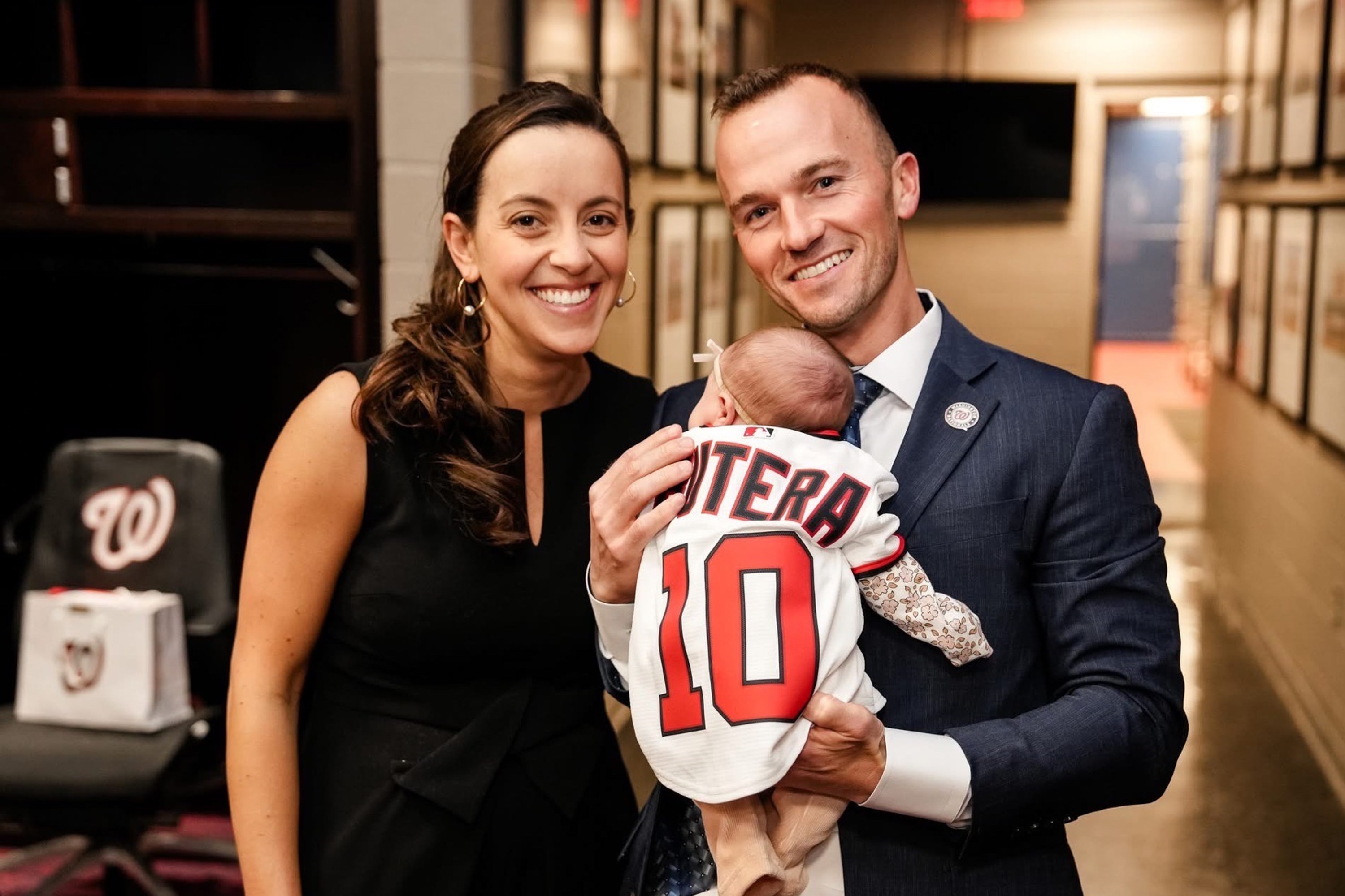 Blake Butera and Caroline Margolis pose with their daughter Blair ahead of Butera's introductory press conference.