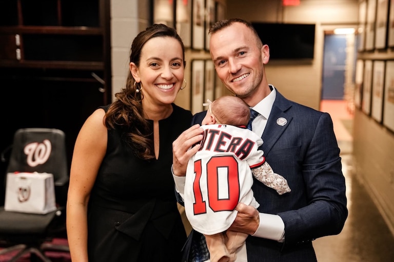 Blake Butera and Caroline Margolis pose with their daughter Blair ahead of Butera's introductory press conference.