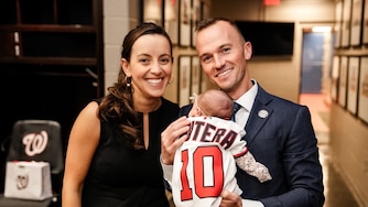 Blake Butera and Caroline Margolis pose with their daughter Blair ahead of Butera's introductory press conference.