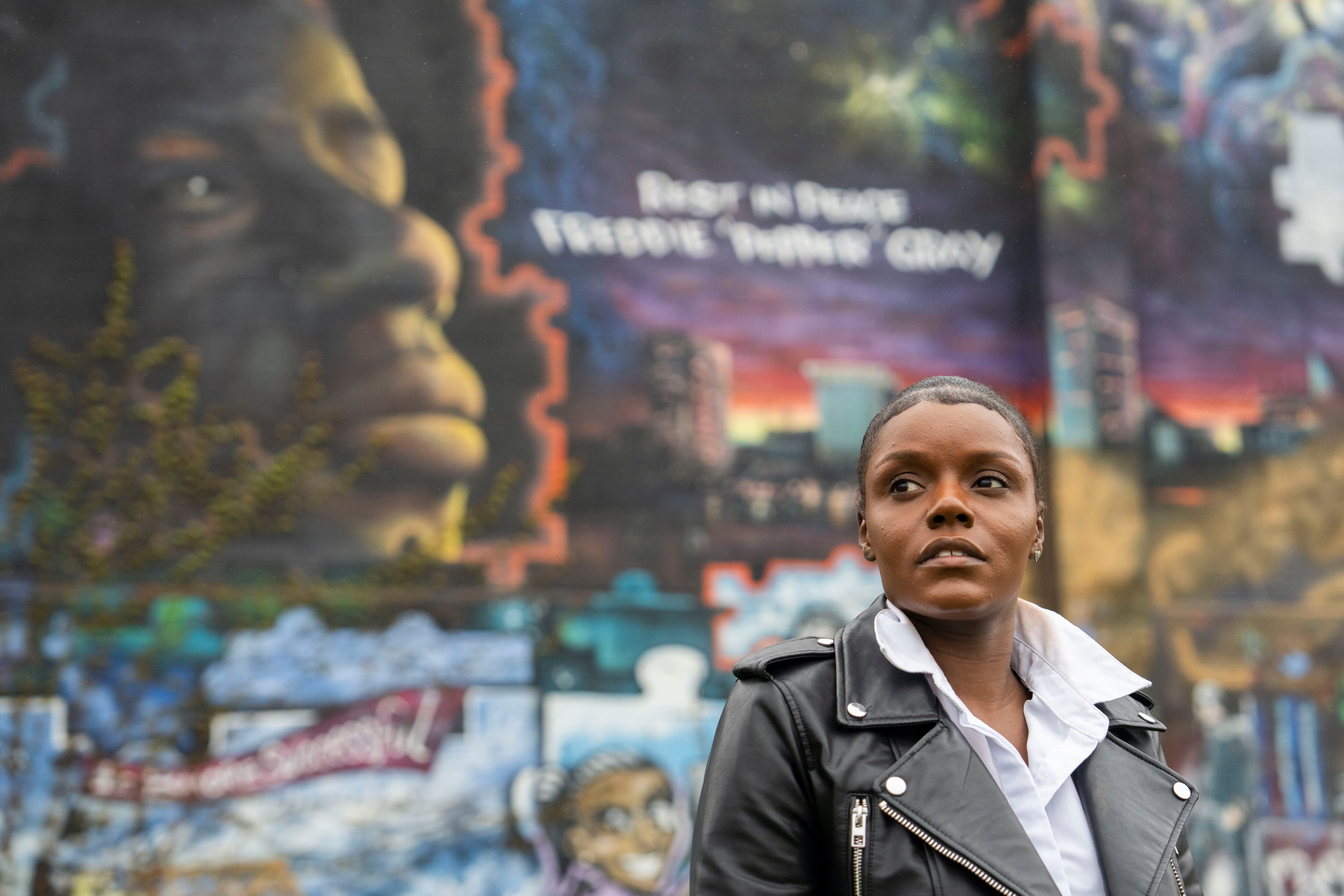 Fredricka Gray, twin sister of Freddie Gray, in front of a mural of her brother on April 7, 2025. 