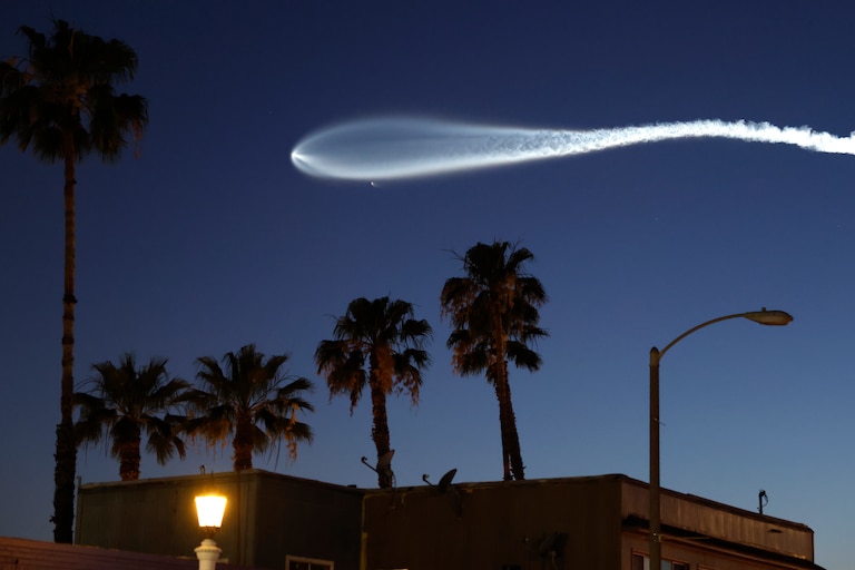 A SpaceX Falcon 9 rocket rises after launching from Vandenberg Space Force Base carrying 25 Starlink internet satellites on April 6, 2026 as seen from Pasadena, California.