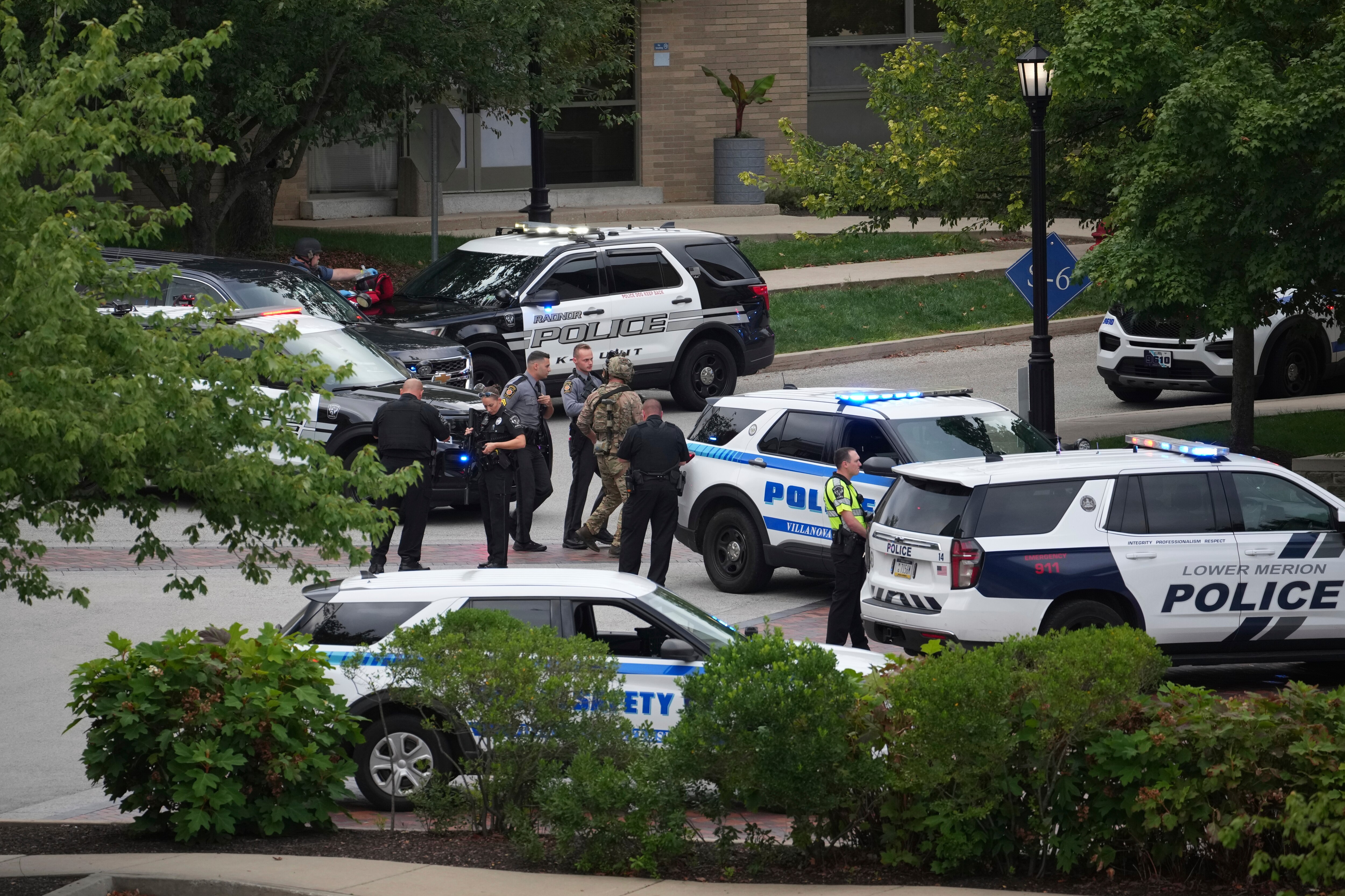 Police gather at the Villanova University campus where an active shooter was reported Thursday, Aug. 21, 2025, in Villanova, Pa.