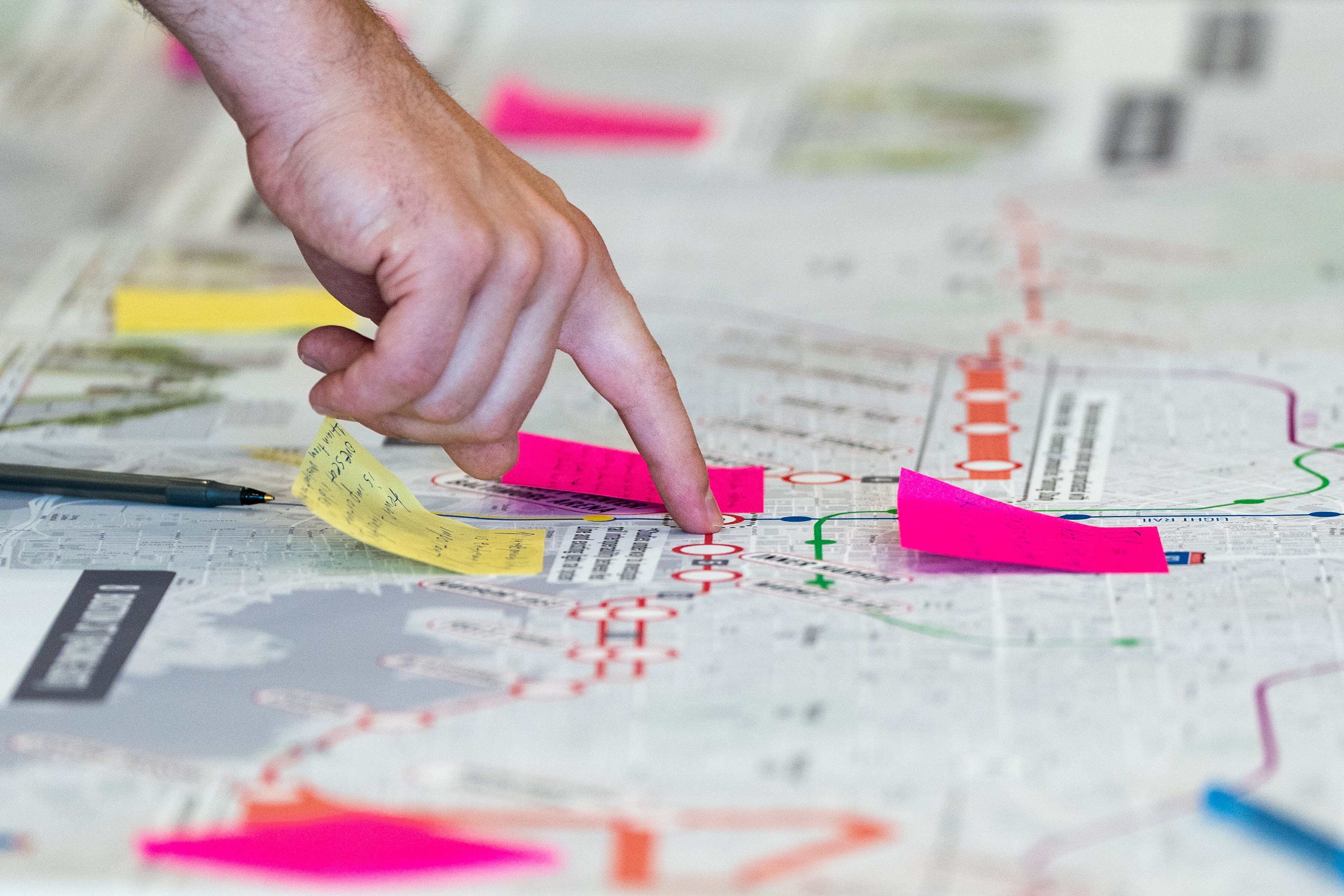 A community member looks at a proposed Red Line map during an MTA open house at the University of Maryland, Baltimore’s SMC Campus Center on Saturday, Nov. 4, 2023.