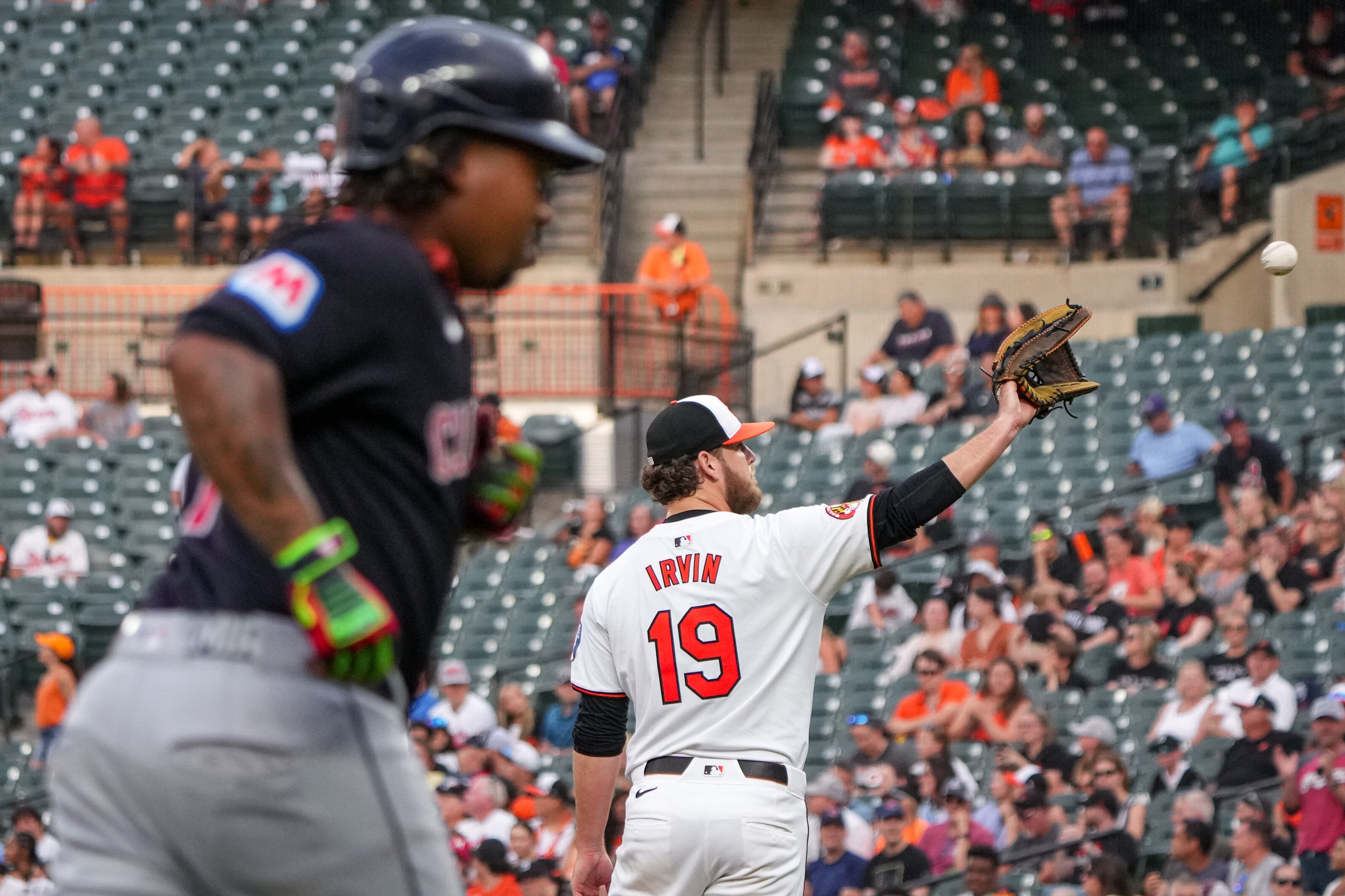 Baltimore Orioles starting pitcher Cole Irvin (19) waits for the ball after giving up a home run to Cleveland Guardians third baseman José Ramírez.
