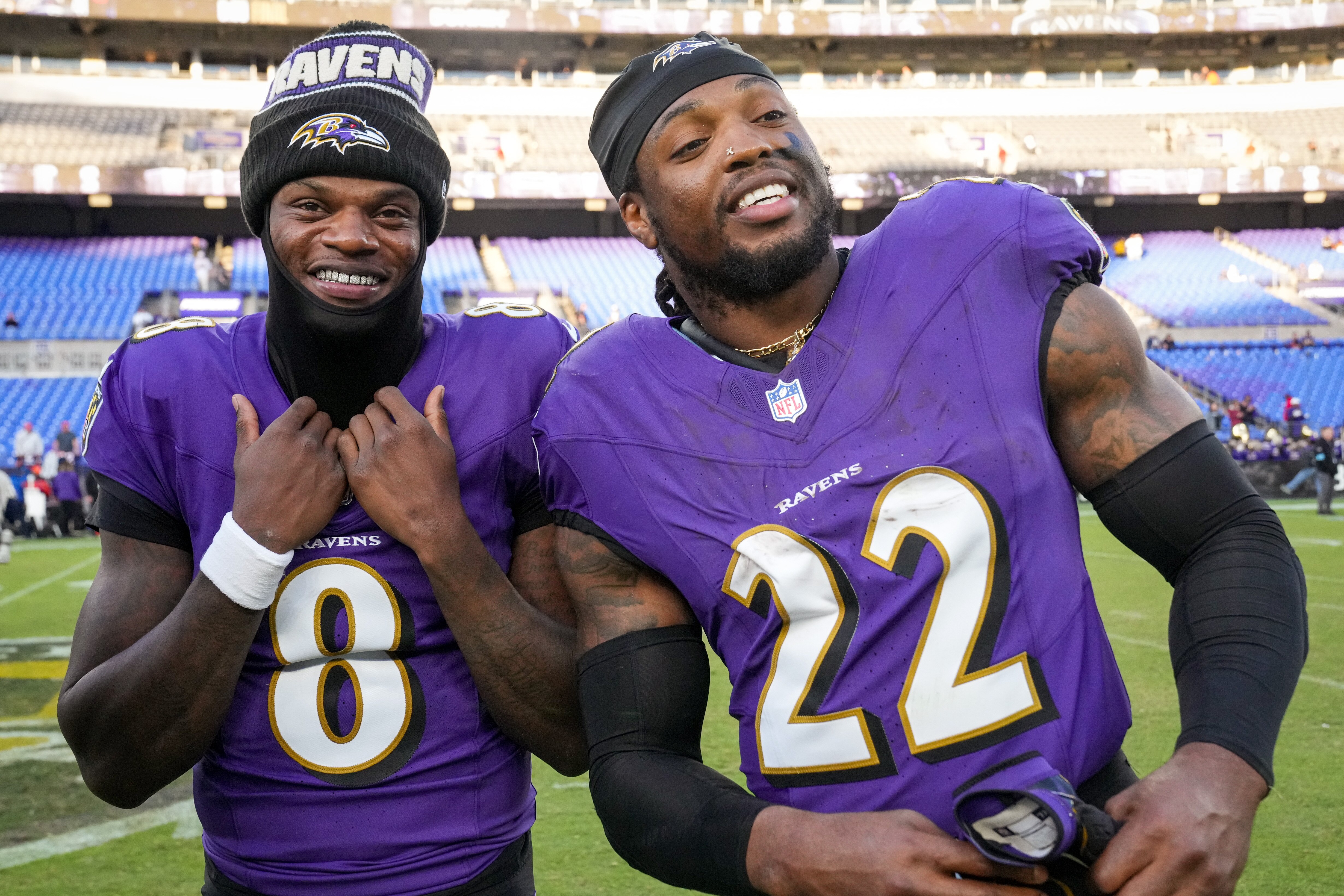Ravens running back Derrick Henry (22) and quarterback Lamar Jackson (8) laugh during an interview together after beating the Denver Broncos at M&T Bank Stadium.