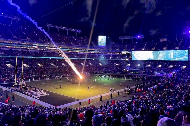 A photo taken by a fan shows a rogue firework landing on the field at M&T Bank Stadium during Sunday's pregame display; no one was hurt.
