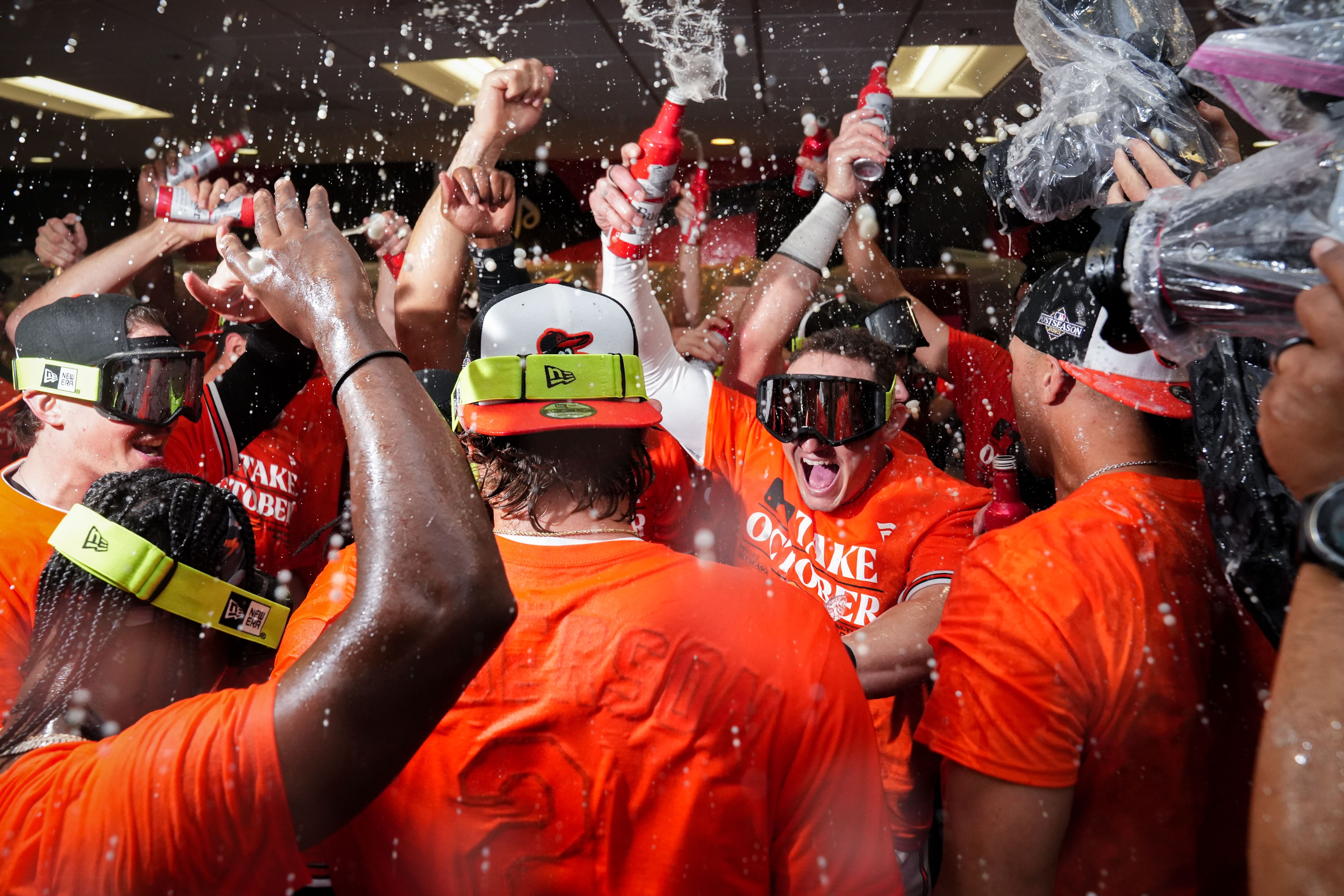 The Baltimore Orioles go wild in the clubhouse following the team’s playoff-clinching win against the Tampa Bay Rays on Sunday, Sept. 17, 2023. The Orioles earned a spot in the playoffs for the first time since 2016.
