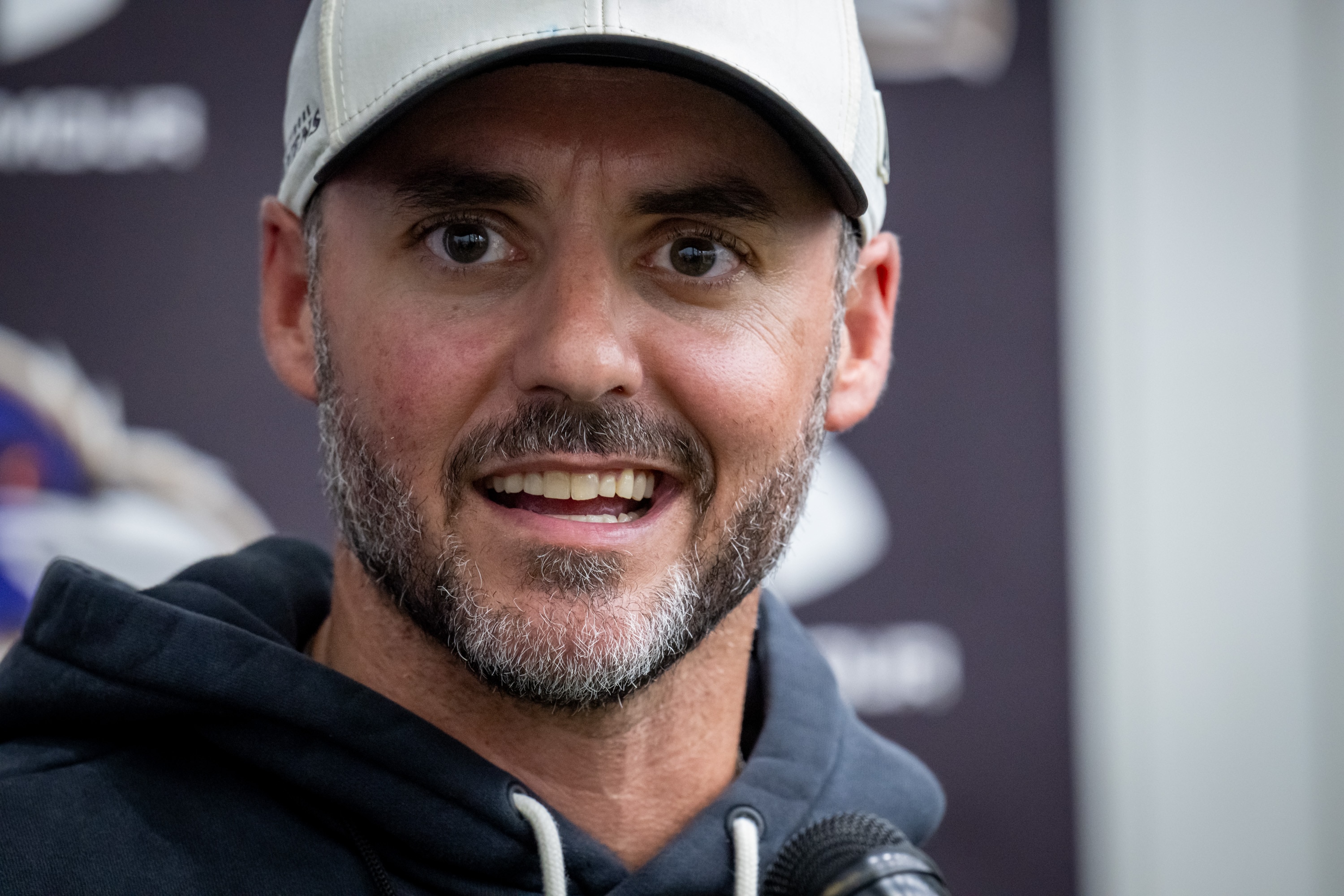 Ravens head coach Jesse Minter takes questions from reporters following organized team activities on May 27.