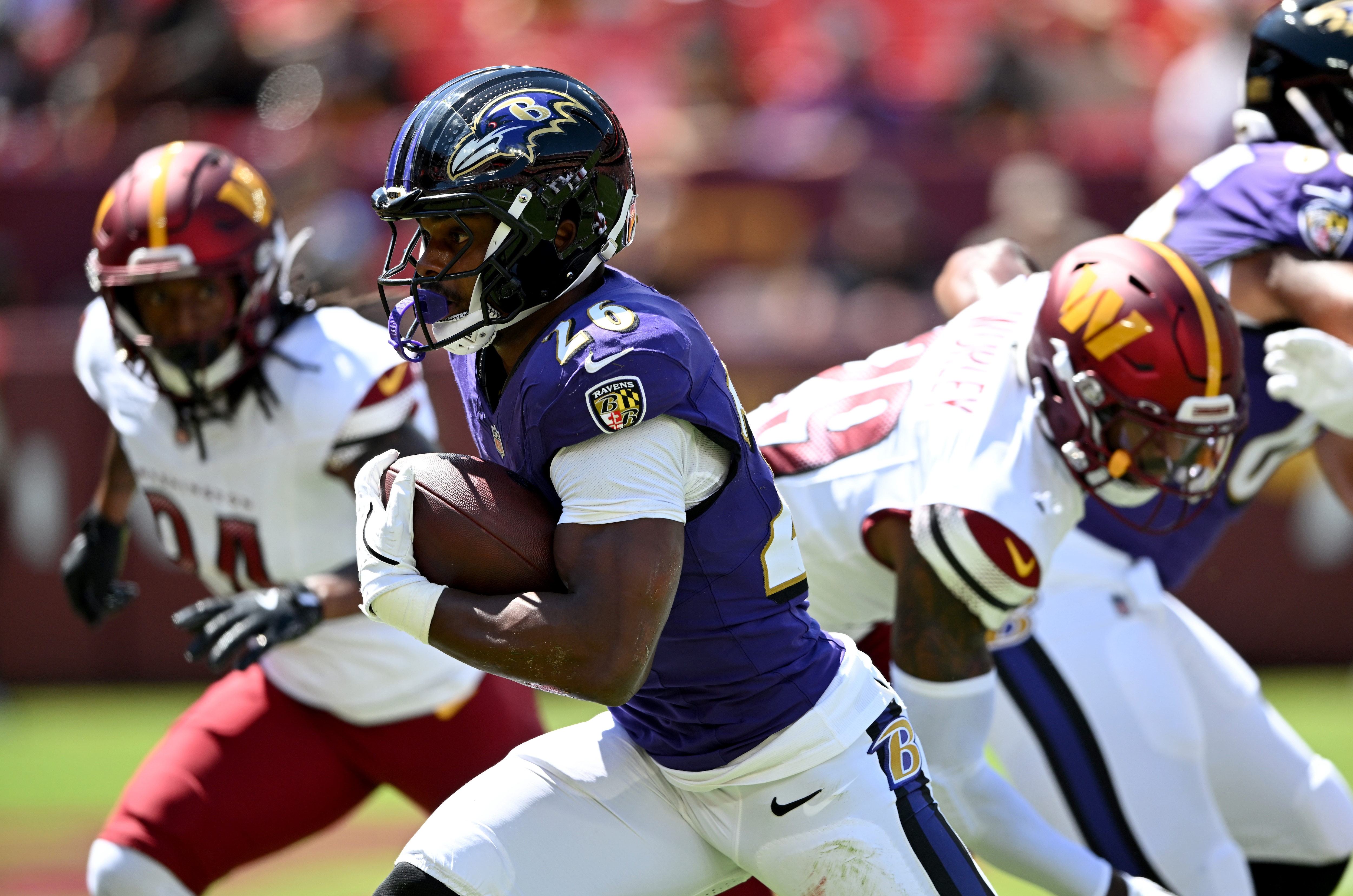 Rasheen Ali runs for a touchdown in the first quarter of the Ravens’ 30-3 preseason win over the Washington Commanders on Saturday in Landover.