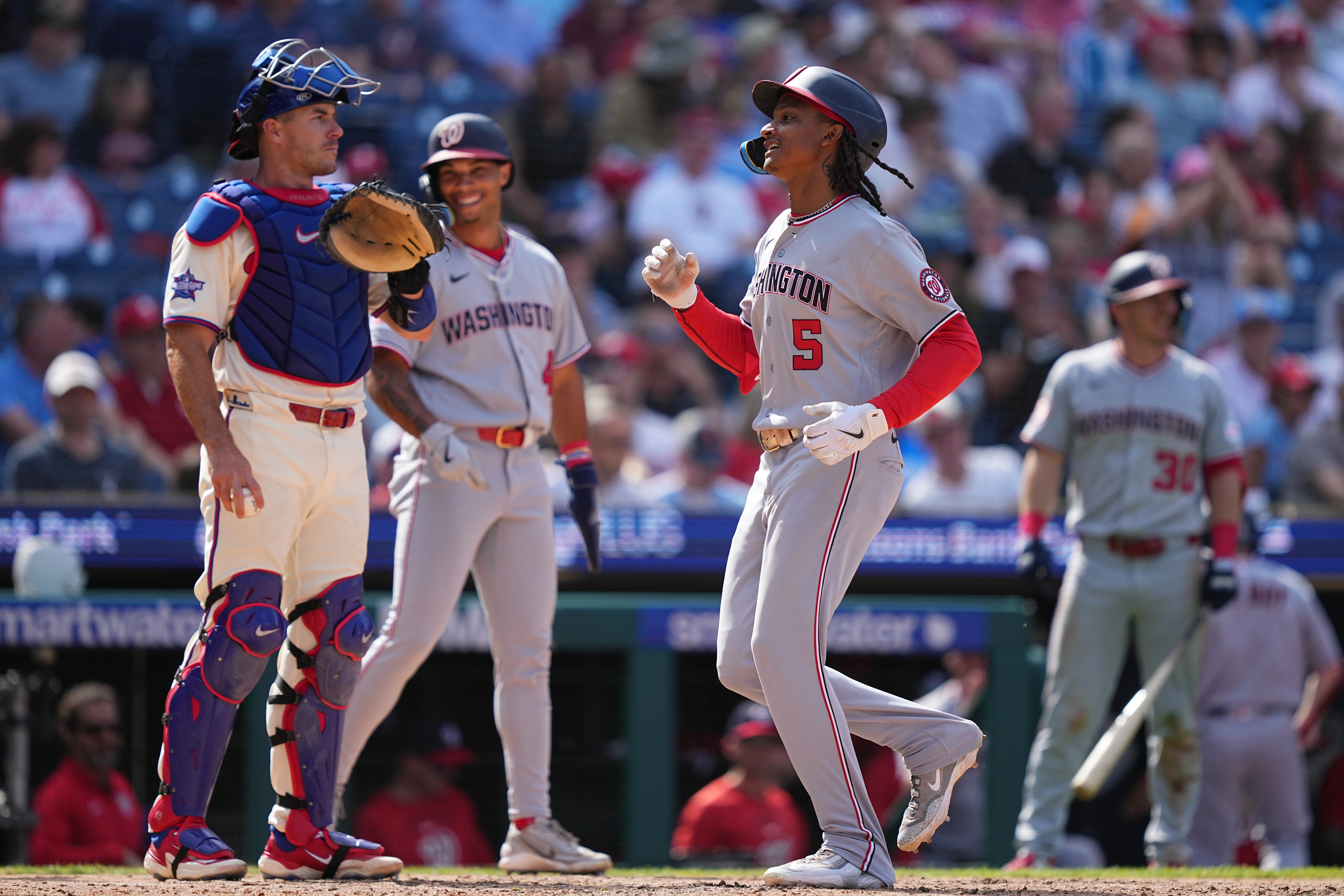 Washington Nationals' CJ Abrams scores after hitting a three-run home run during the seventh inning.