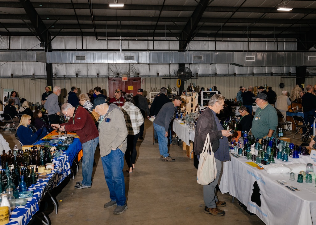 Attendees peruse vendor tables at The Baltimore Antique Bottle Club 45th Annual Show & Sale at the Howard County Fair Grounds