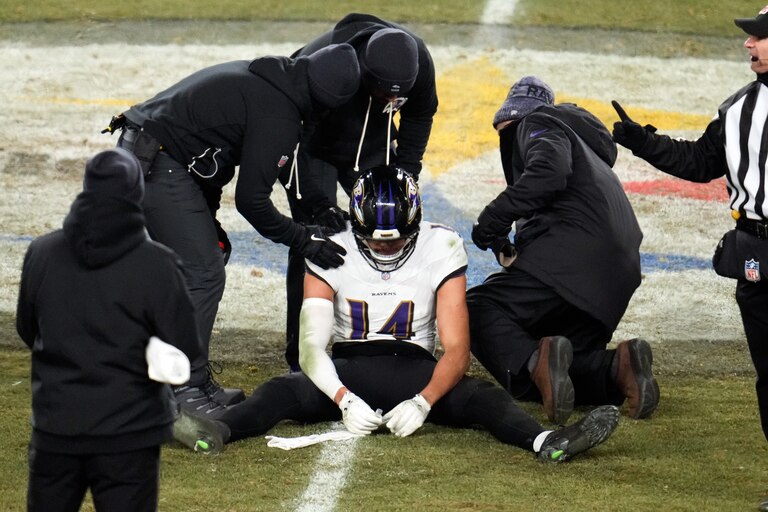 Baltimore Ravens safety Kyle Hamilton (14) is looked at after a play during the second half an NFL football game against the Pittsburgh Steelers, Sunday, Jan. 4, 2026, in Pittsburgh.