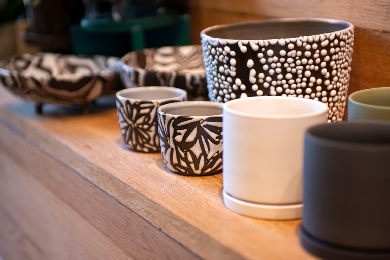 Planters by local ceramist Personal Best Ceramics at green neighbor in Hampden.